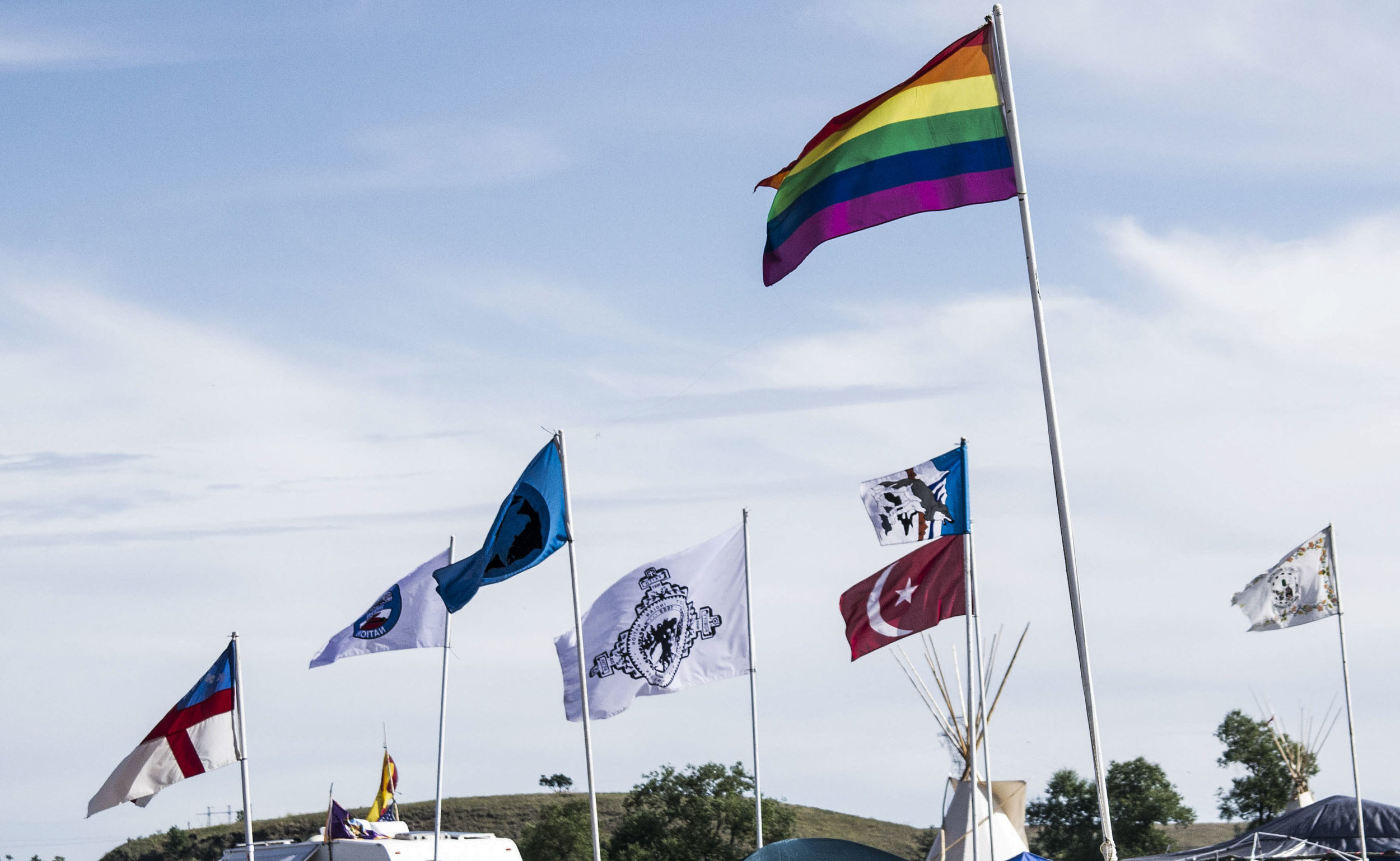 Flags from different Tribes and supporters you see as you drive into Standing Rock Camp.
