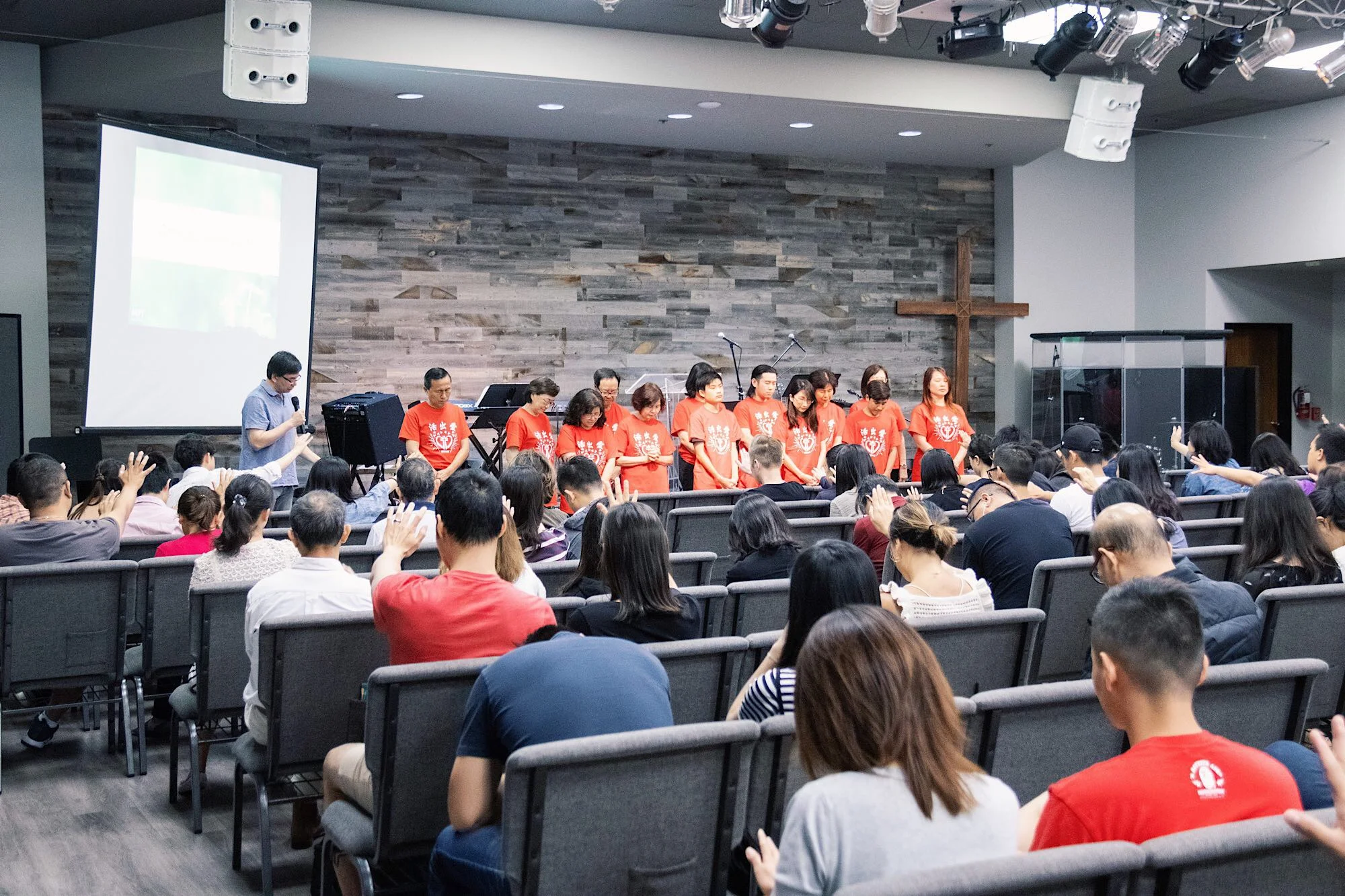 Stretching out hands to pray and send off mission team