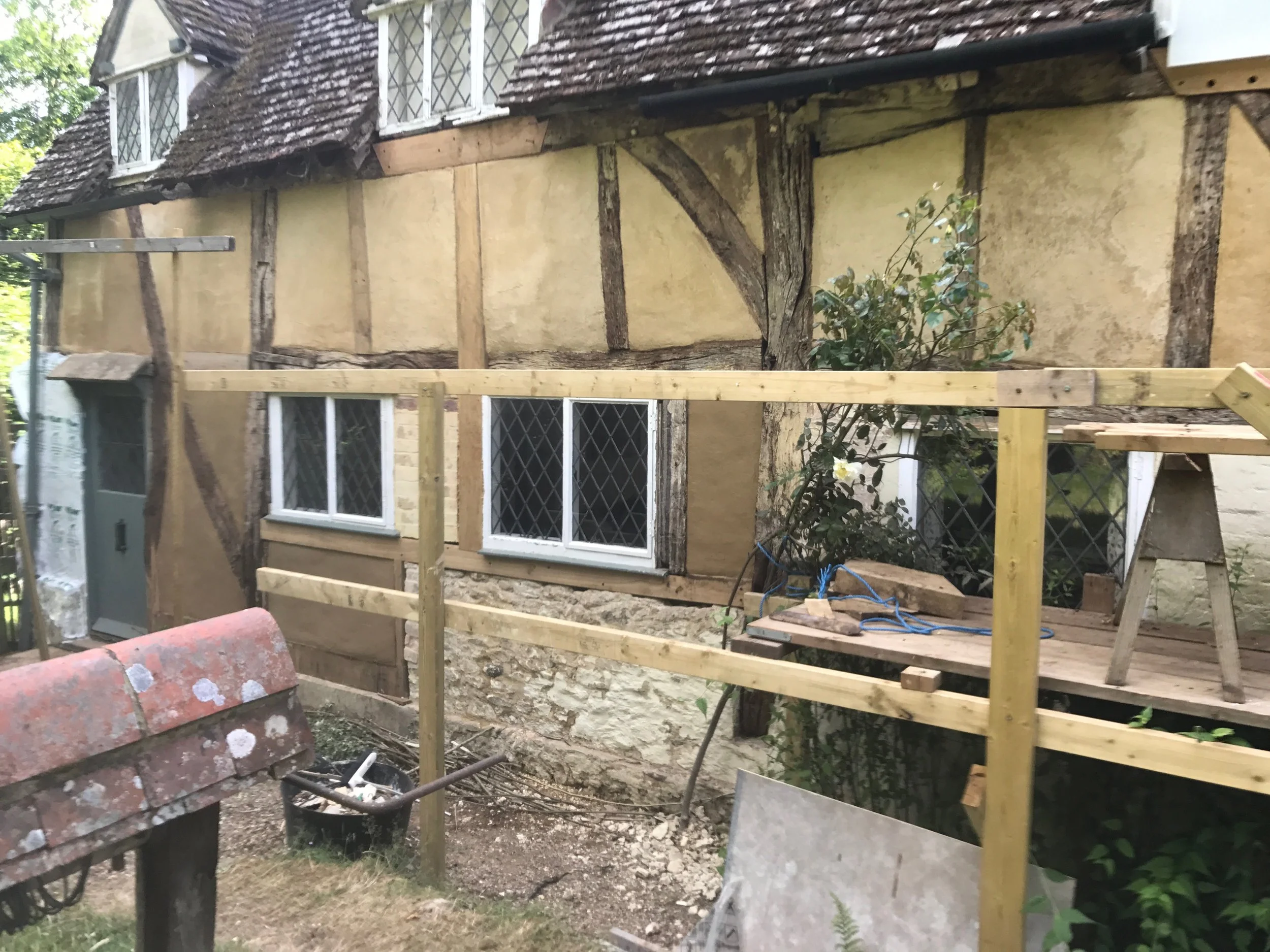 In this image most of the structural timbers and wattle and daub panels have been repaired. Just the lime wash needs to be added.