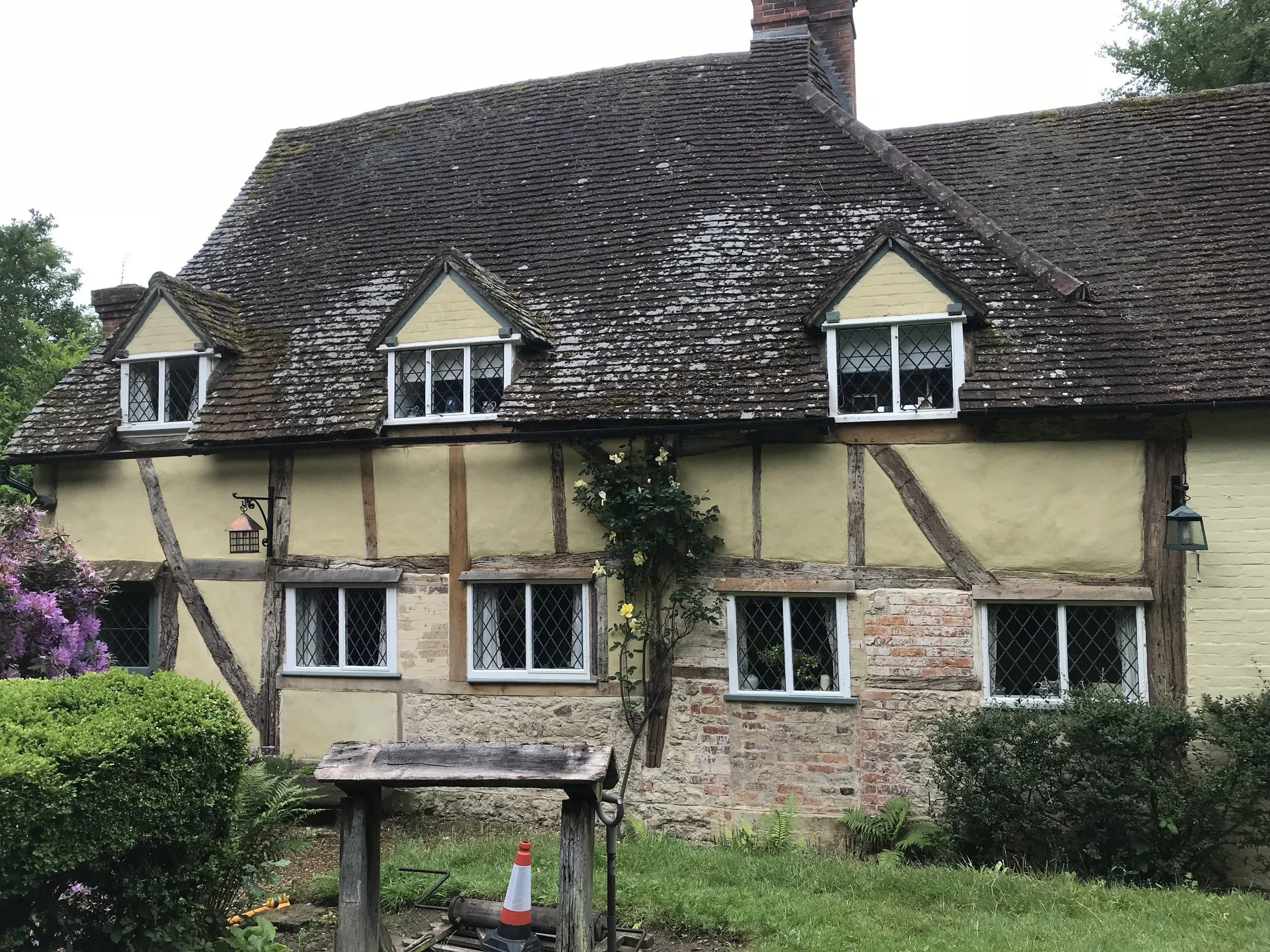 This image shows the completed elevation. Repaired structural timbers in Oak and repaired and renewed wattle and daub panels