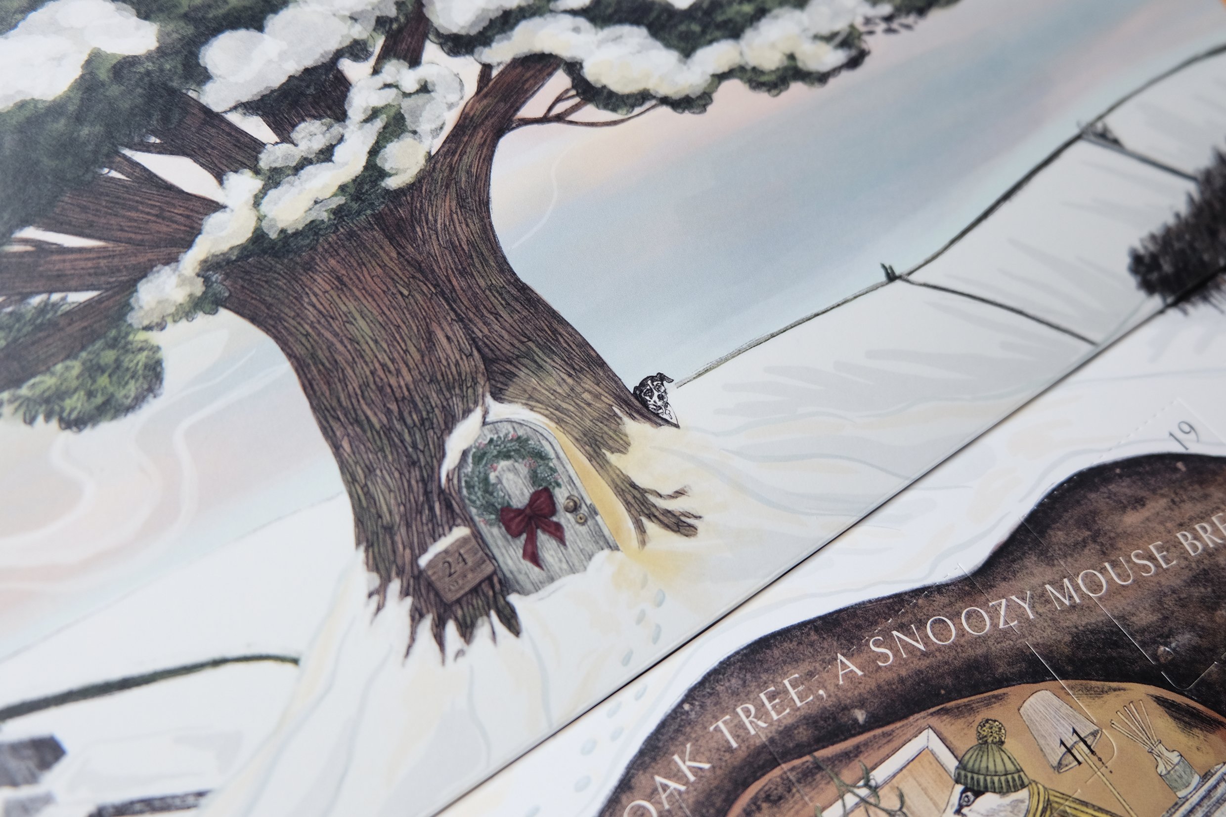 Glass & Wick's own dog, Angel, always features in every advent calendar, so here she is hiding behind the tree!