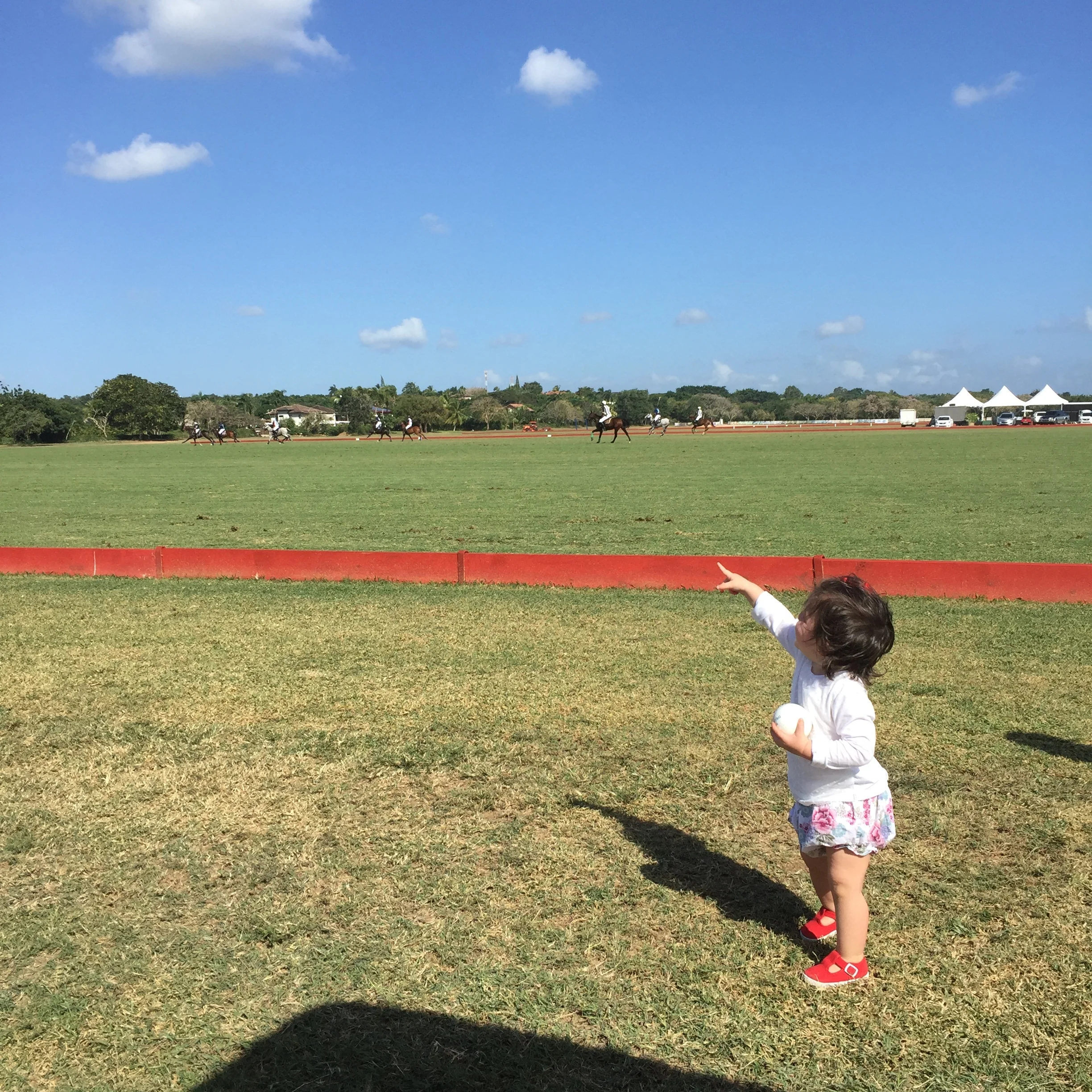 Polo has come a long way at Casa de Campo. It was such a treat and very exciting to get to check out high goal polo while visiting. Such a beautiful setting and easily accessible to the public. Make sure to check it out if you are in CDC this season. She is fascinated by all things in the sky, in this case the "Polo Drone".
