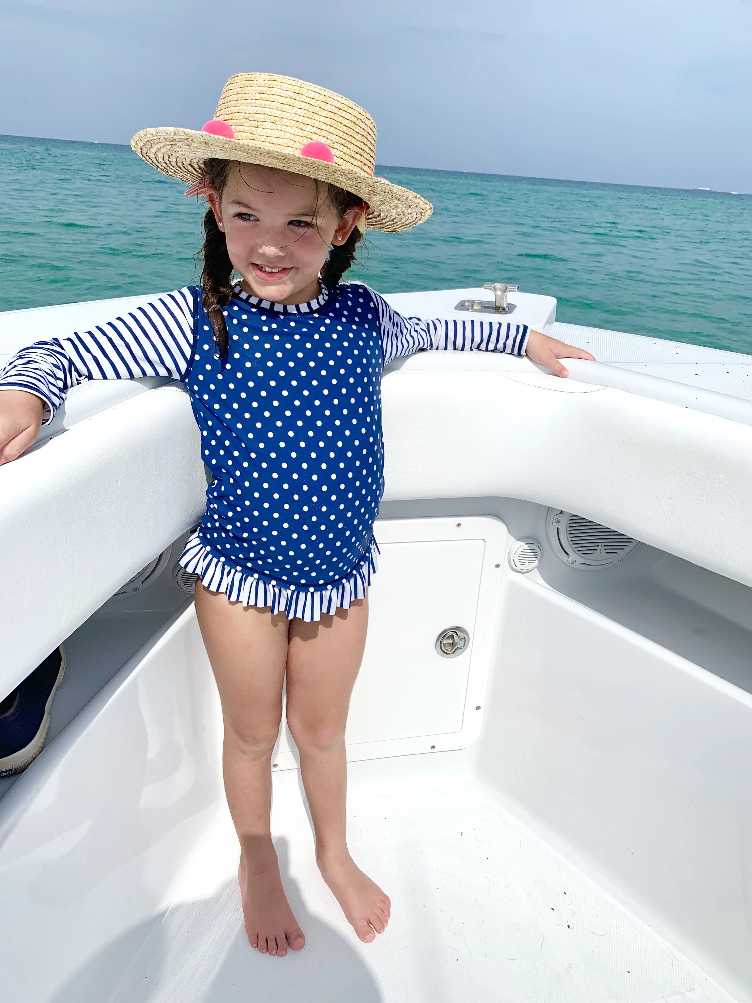 We love our Ruffle Butts rash guard sets and get them at Mother Goose Miami. I take sun prevention seriously these days.