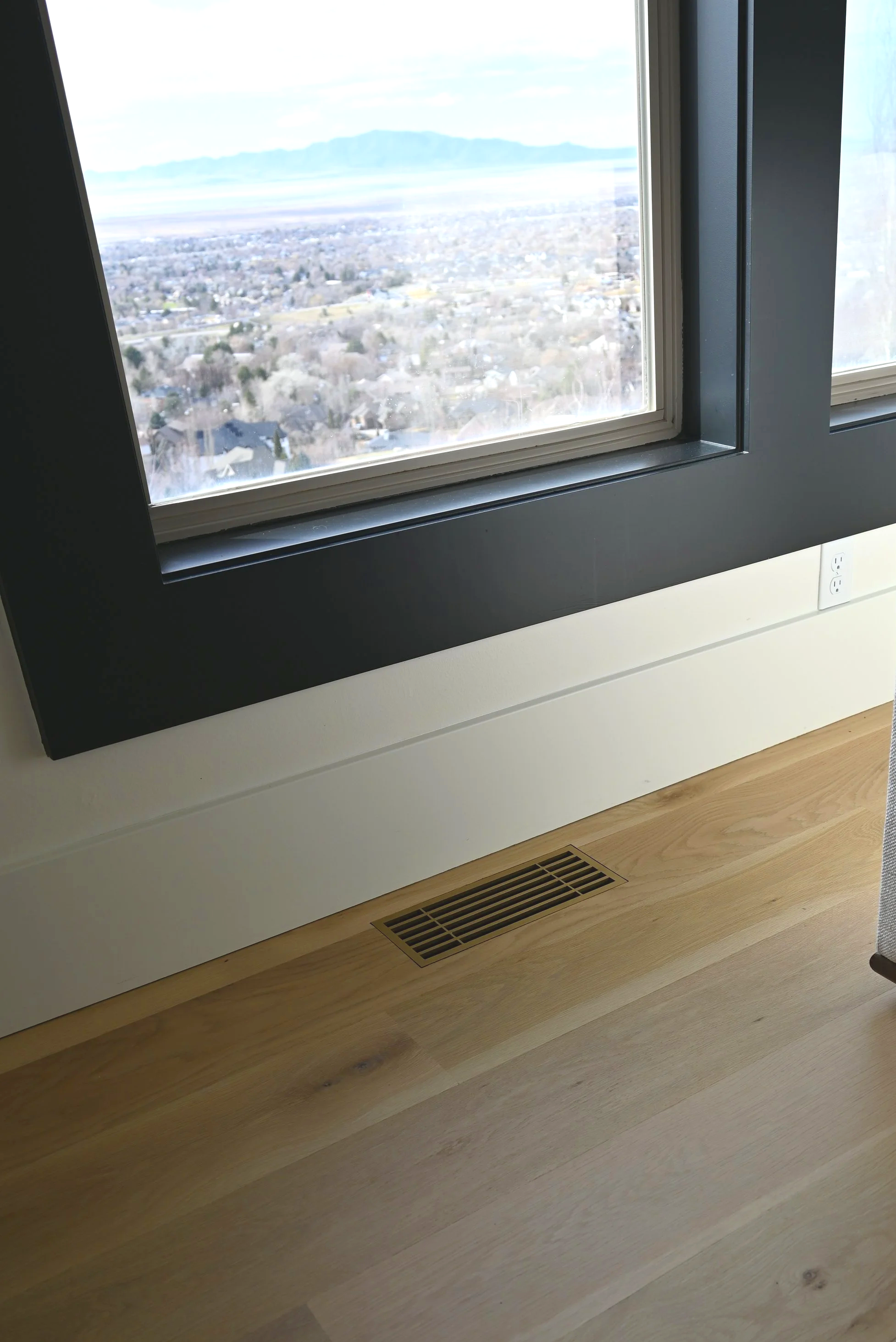 Modern flush mounted floor register for minimalistic design in a vintage gold powder coated finish. 