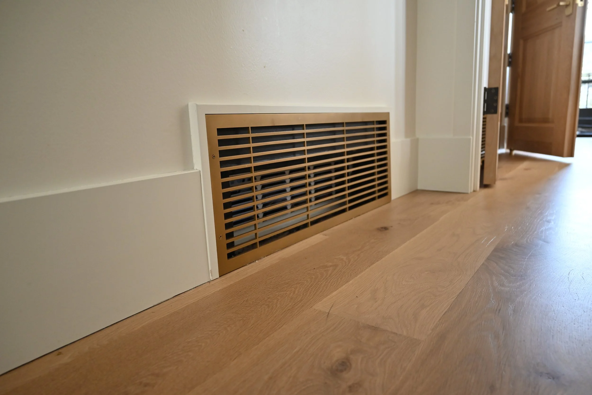 Oversized decorative return air grill in a vintage gold color.