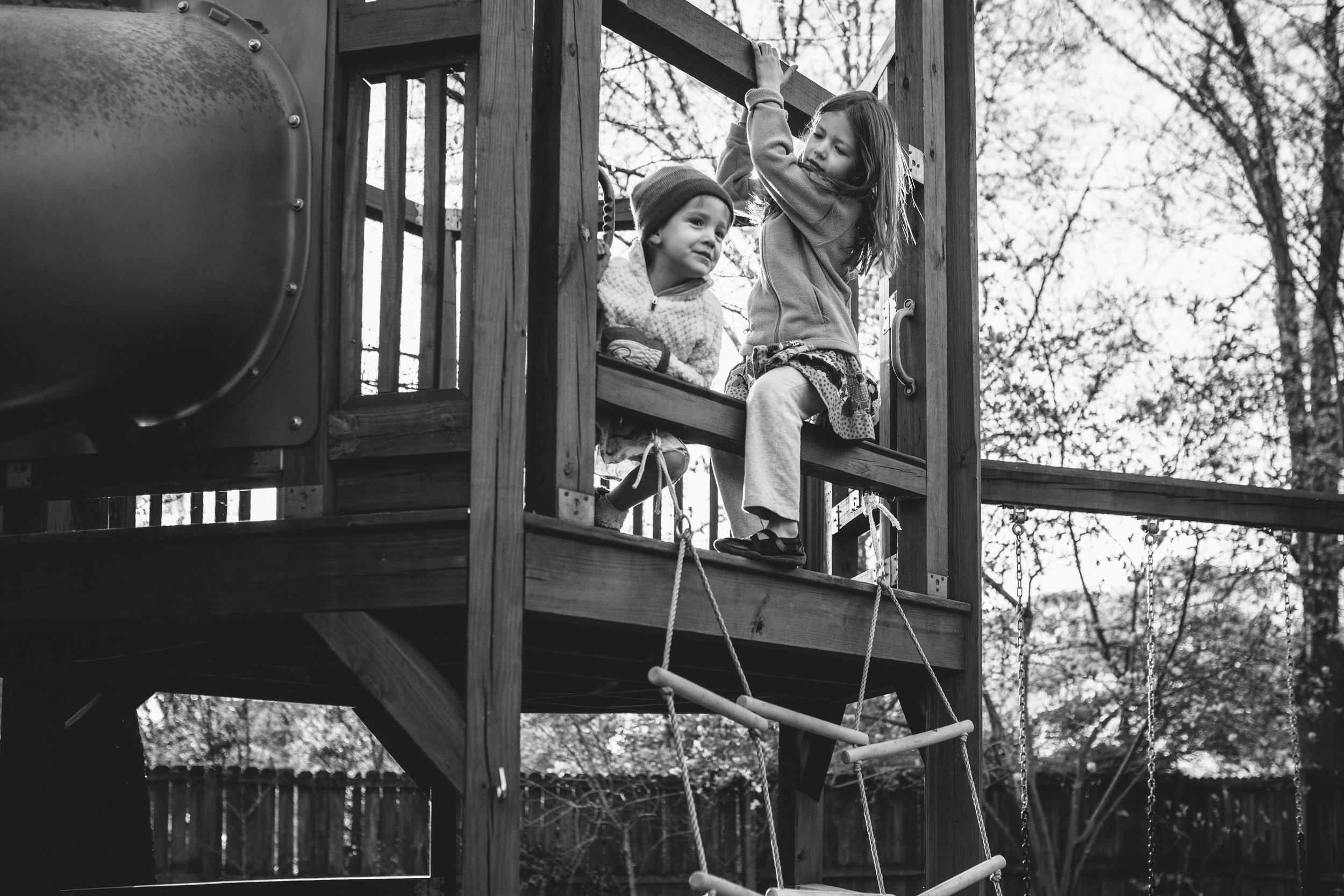 two sisters in playhouse from family documentary photography session in atlanta