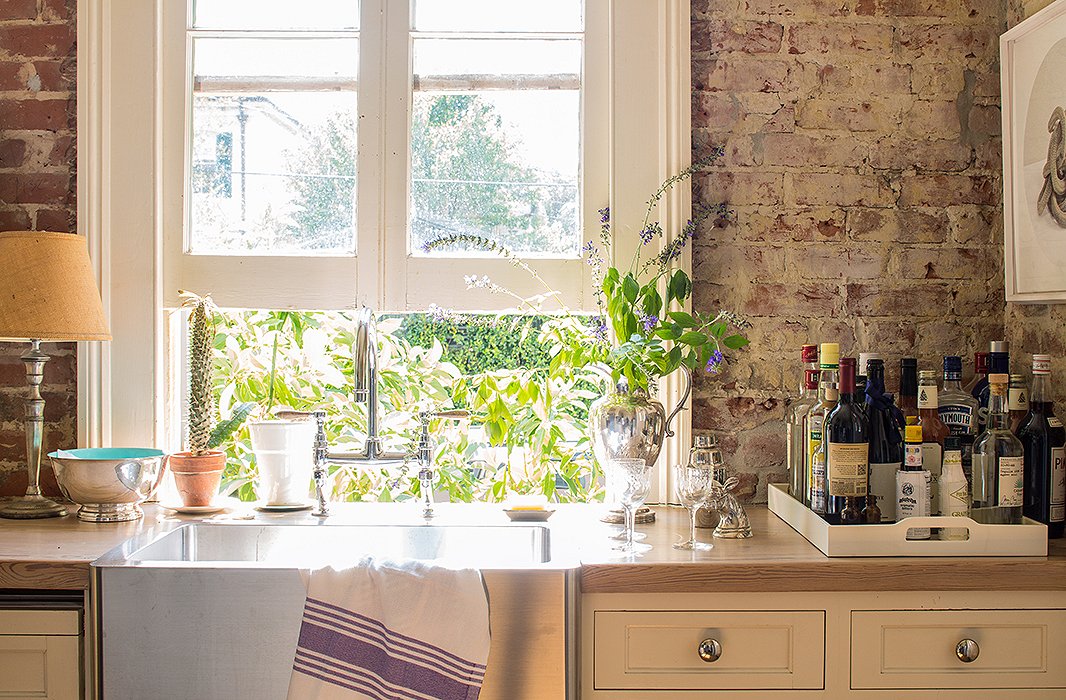 The butler’s pantry houses the liquor, neatly corralled. “I can’t say enough about trays. I want to open a store that sells nothing but trays. Look how much better these bottles look on a tray. If they were just sitting on the counter they would look so awkward.”