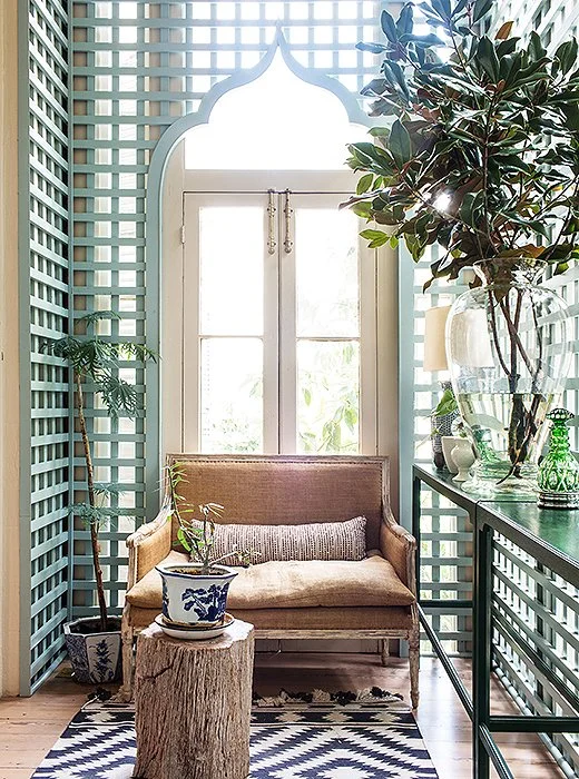 Using trellises indoors is a Southern tradition. Sara replaced the aging trellis in the house with a new one featuring a Moorish arch inspired by designer Furlow Gatewood and painted it a modern but subdued gray-green.