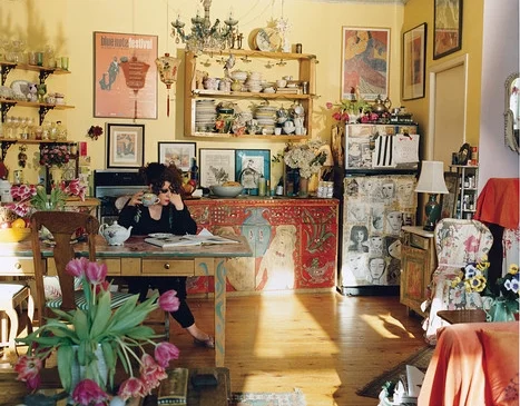 McCluskey, in her kitchen, treats everything in her apartment as a canvas, even the refrigerator. ‘My thing is painting tables,’ she says. 'I can’t bear a simple surface.' Photograph by Emma Hardy