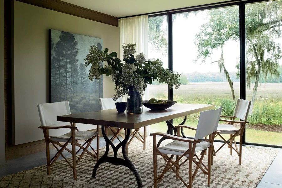In the dining room, Liaigre chairs surround a custom table from Skylar Morgan on a hemp rug from Ralph Lauren Home.&nbsp;Simon Upton