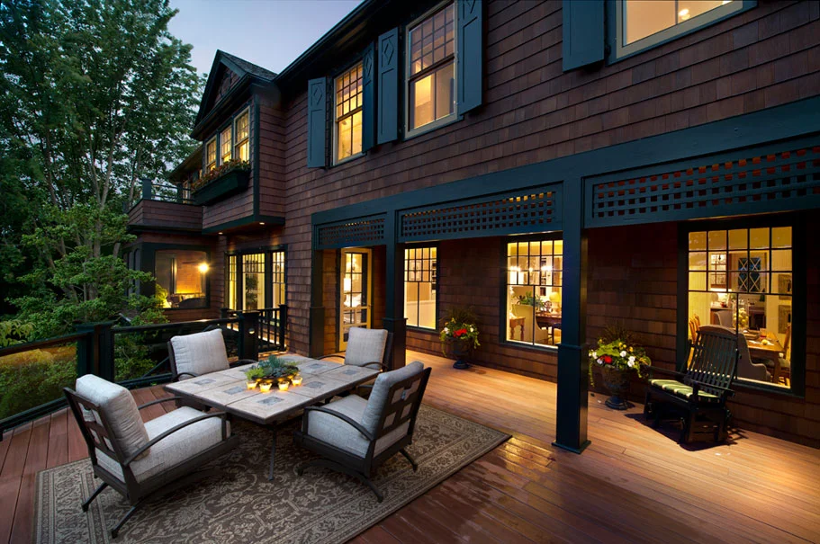 The old porch was extremely narrow. The new porch is expansive and takes advantage of the view. The changes are seamless, leaving no trace of where the old structure ended and the new porch began.
