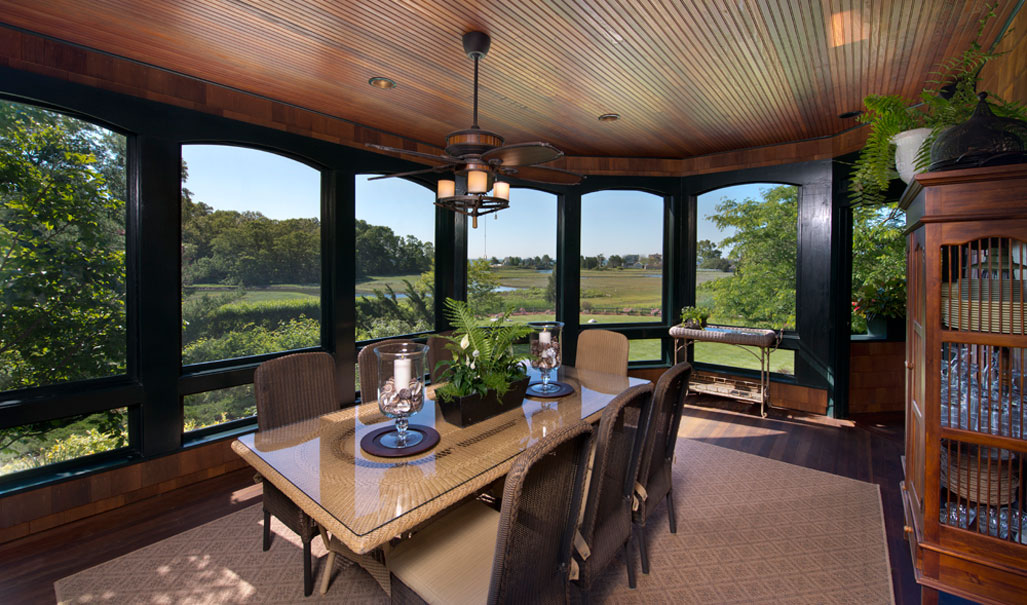 This outdoor porch allows you to dine outside without concern for the elements.