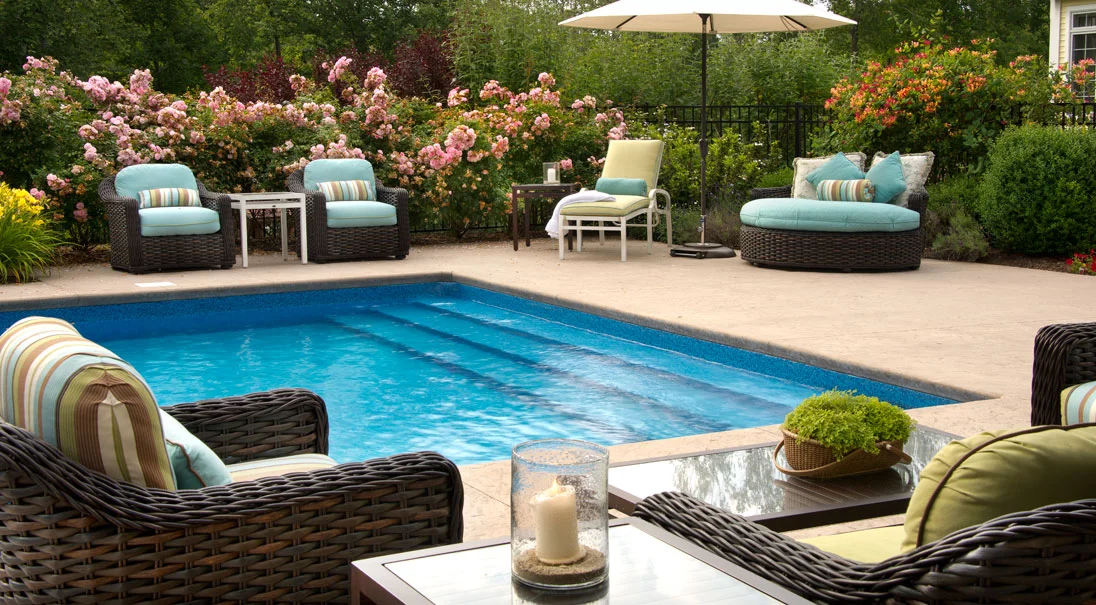 The pool area is surrounded by additional comfy lounge seating, designed for socializing and relaxation. Colors were chosen to complement the outdoors and the beautiful surrounding gardens.