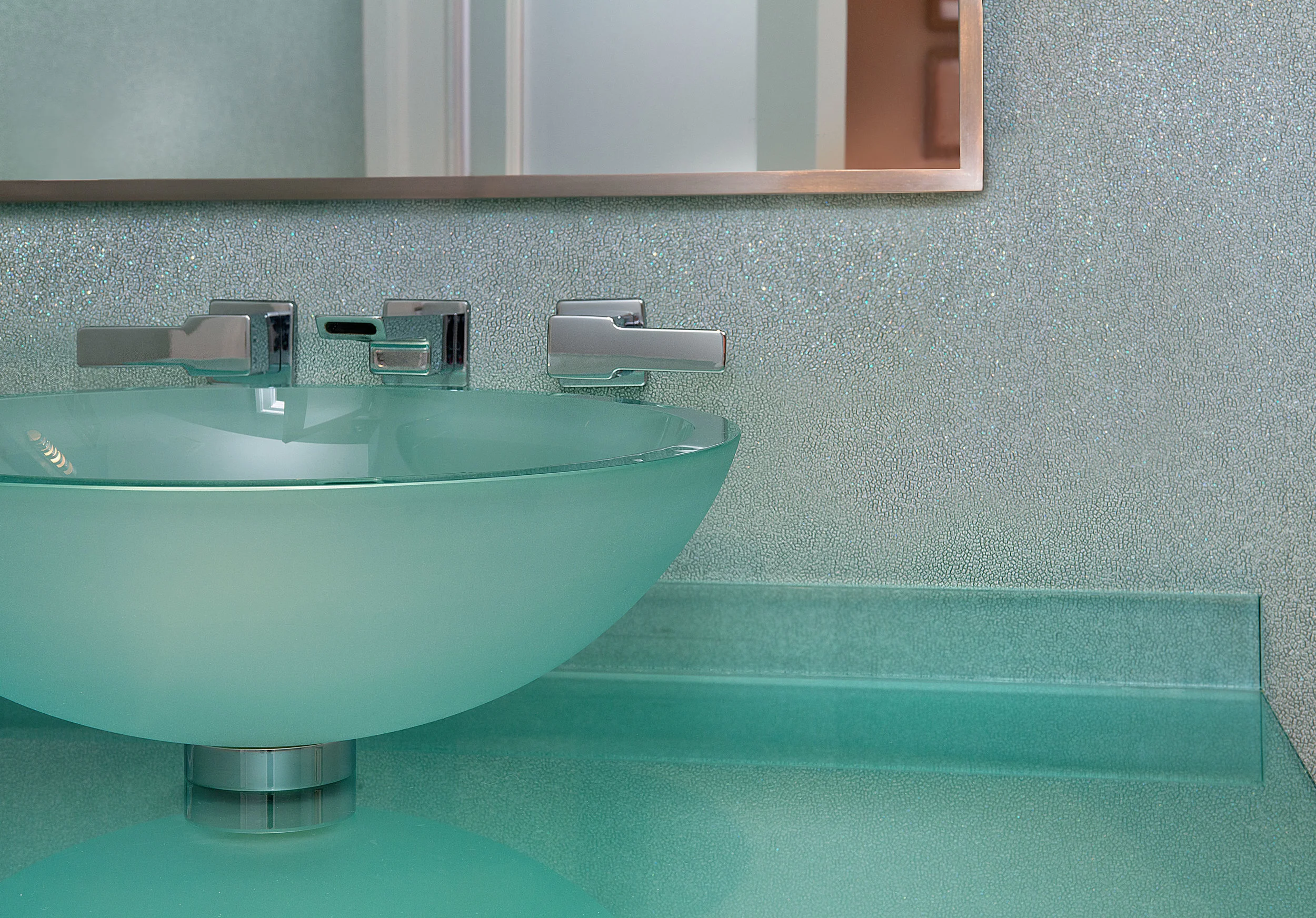 We chose a glass vessel sink to create a light contemporary feel.