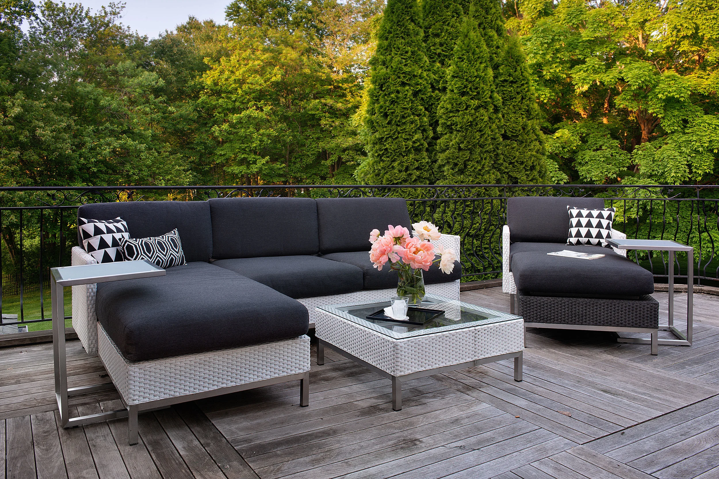 We then carried the black and white pallet to the outdoors tying it in with strong geometric patterned pillows.