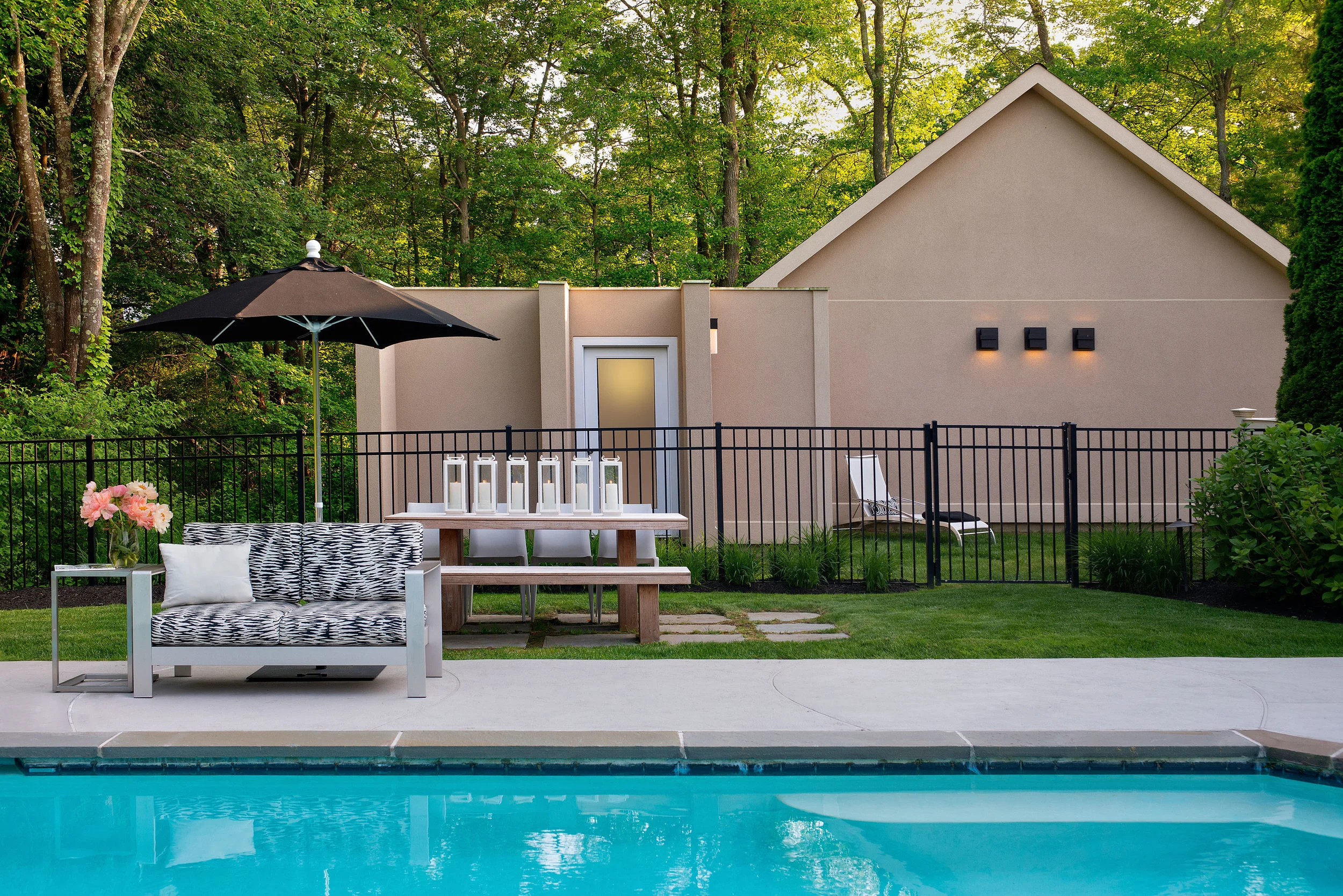 A contemporary pool cabana was added to provide additional pool storage and garage space.