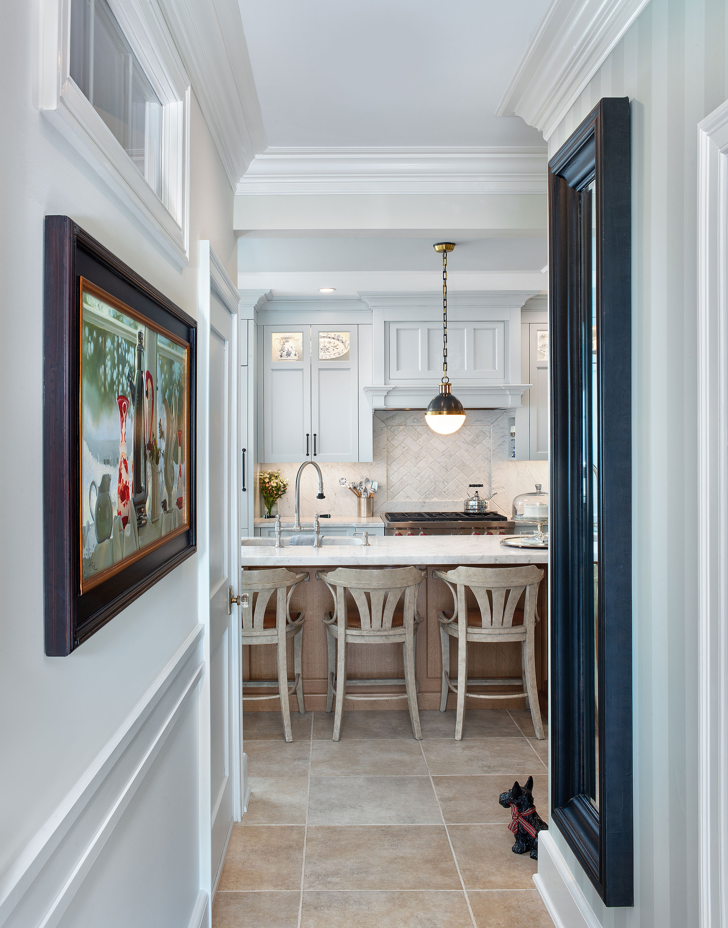 The quarter sawn oak island provides a soft contrast to the blue cabinets.