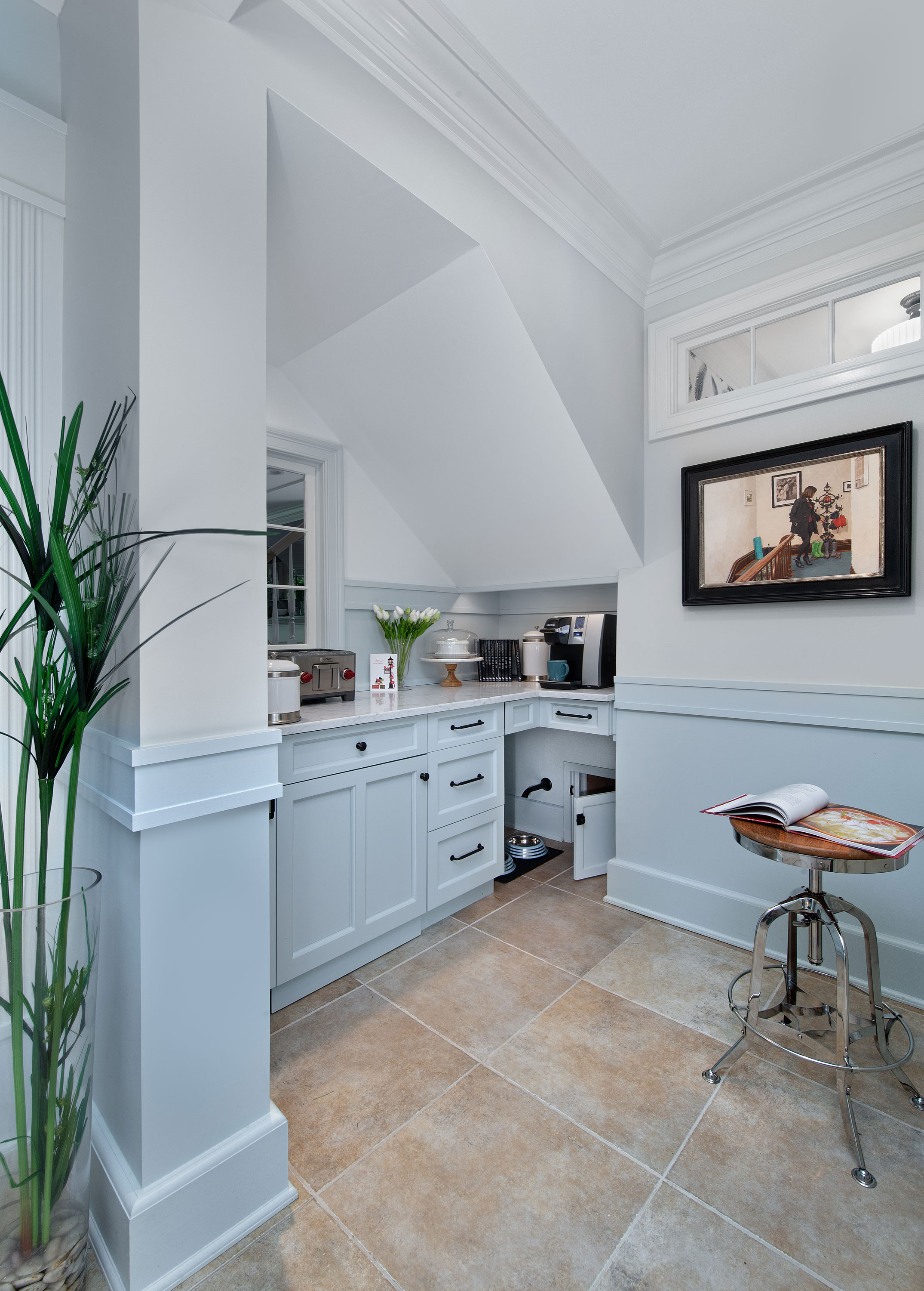 Custom built-ins were created to maximize all space, including a feeding station for the family pets.