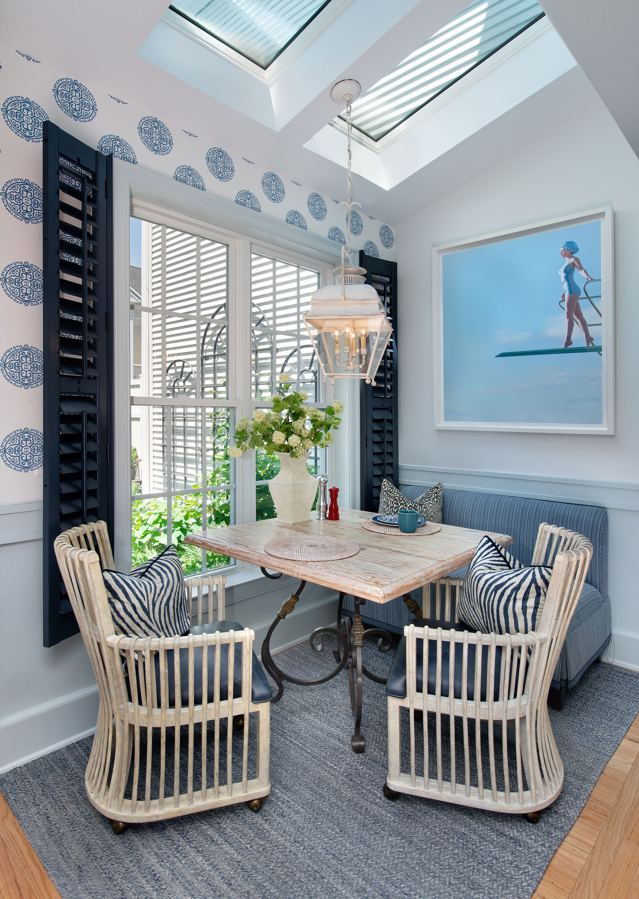 The kitchen alcove overlooking the outside gardens create a bright spot for breakfast and small gatherings.