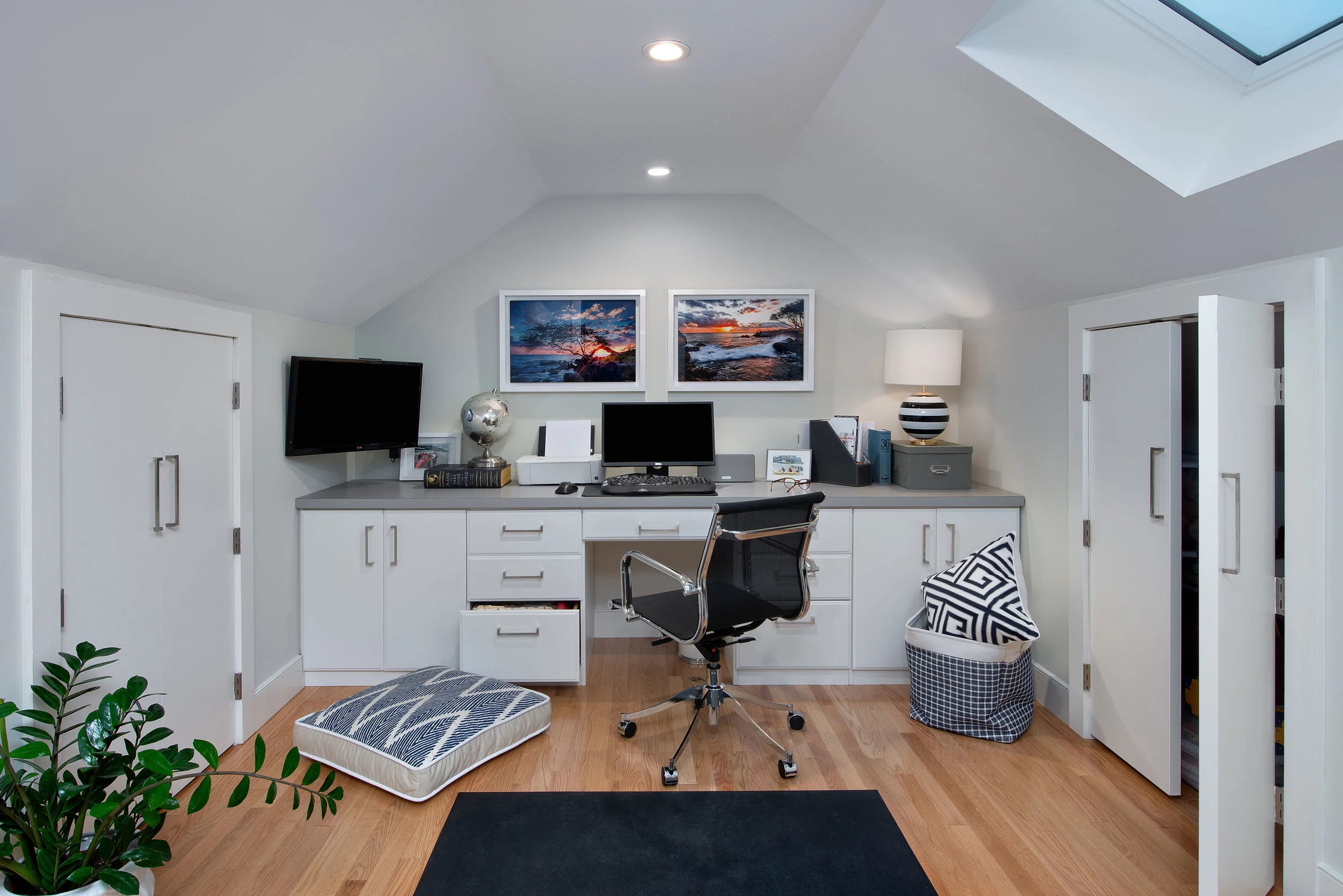 The angled third floor roof lines make for a cozy office area.
