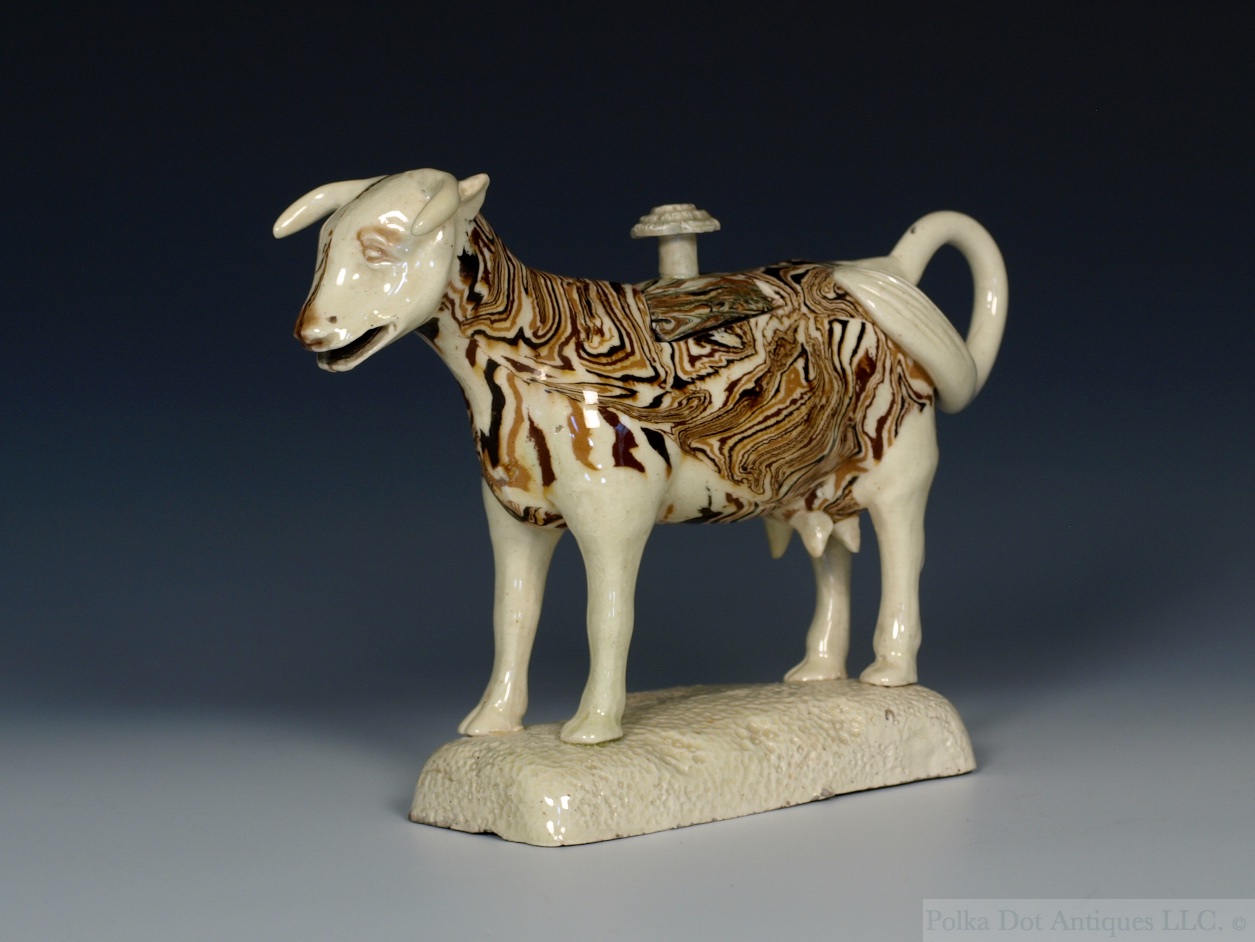 Rare Staffordshire Solid Agate Ware Cow Creamer, c.1775. Provenance – Captain C. B. Kidd Collection. Sotheby’s, London, 10/1/67. Lot - 37. Christie’s, London, 1/6/70. Lot – 95. Boswell and Ward.