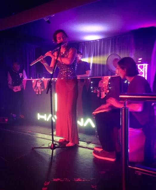 Naomi West provides a flute accompaniment to DJ Stefunk.
