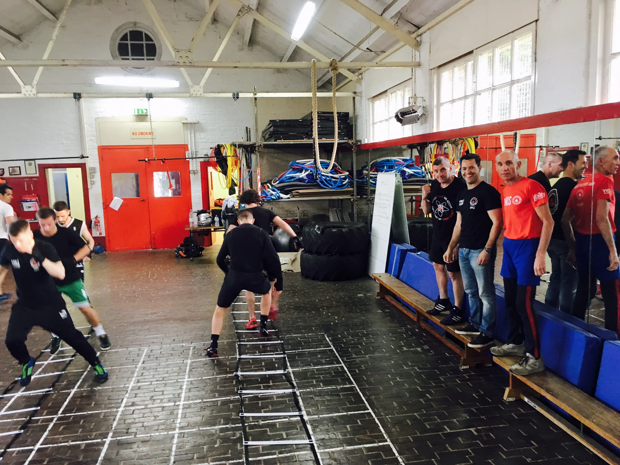 The coaches put the boxers through footwork drills.