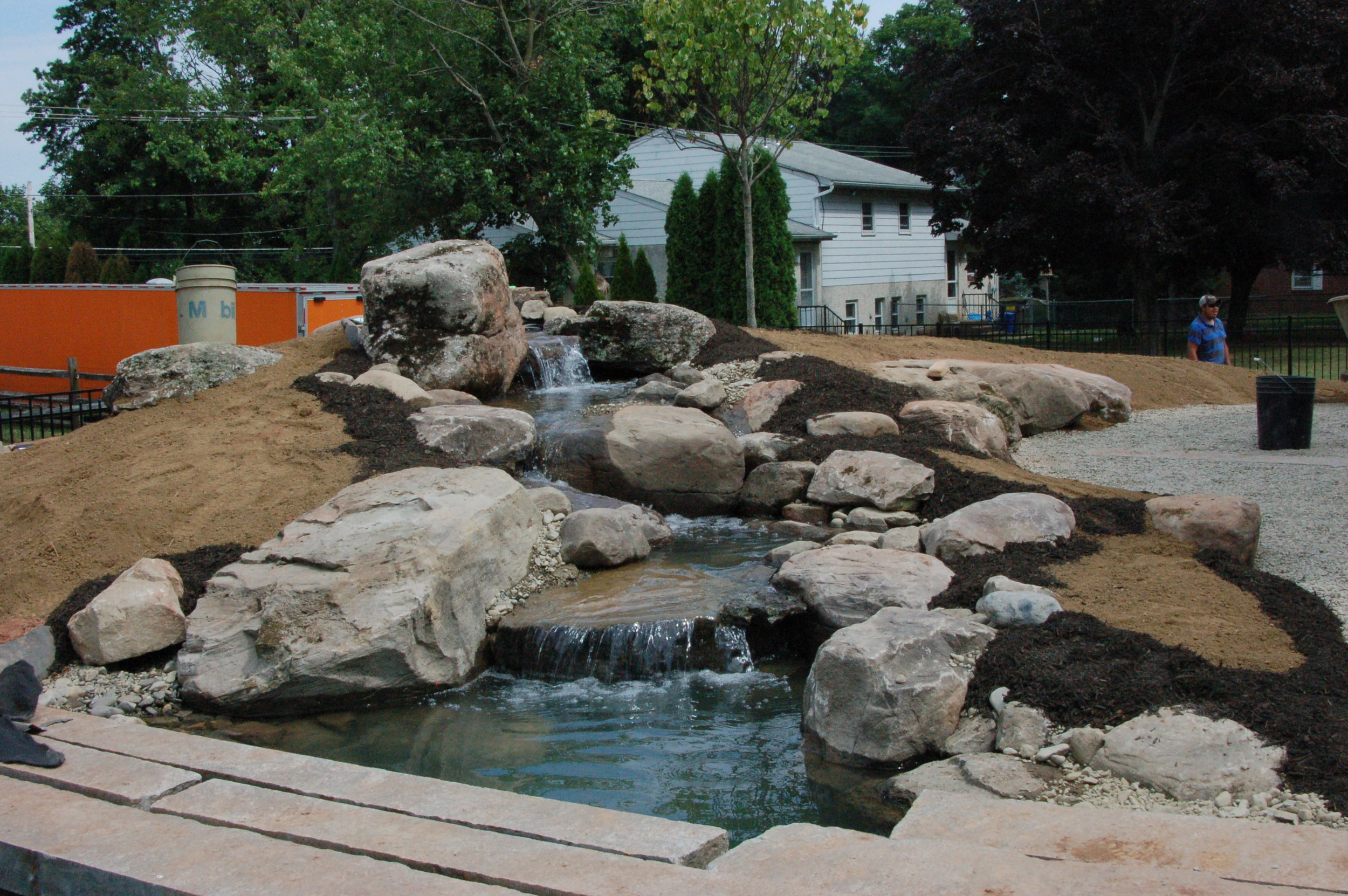 Pondworks_bridge_design build_custom_boulders_pond.JPG