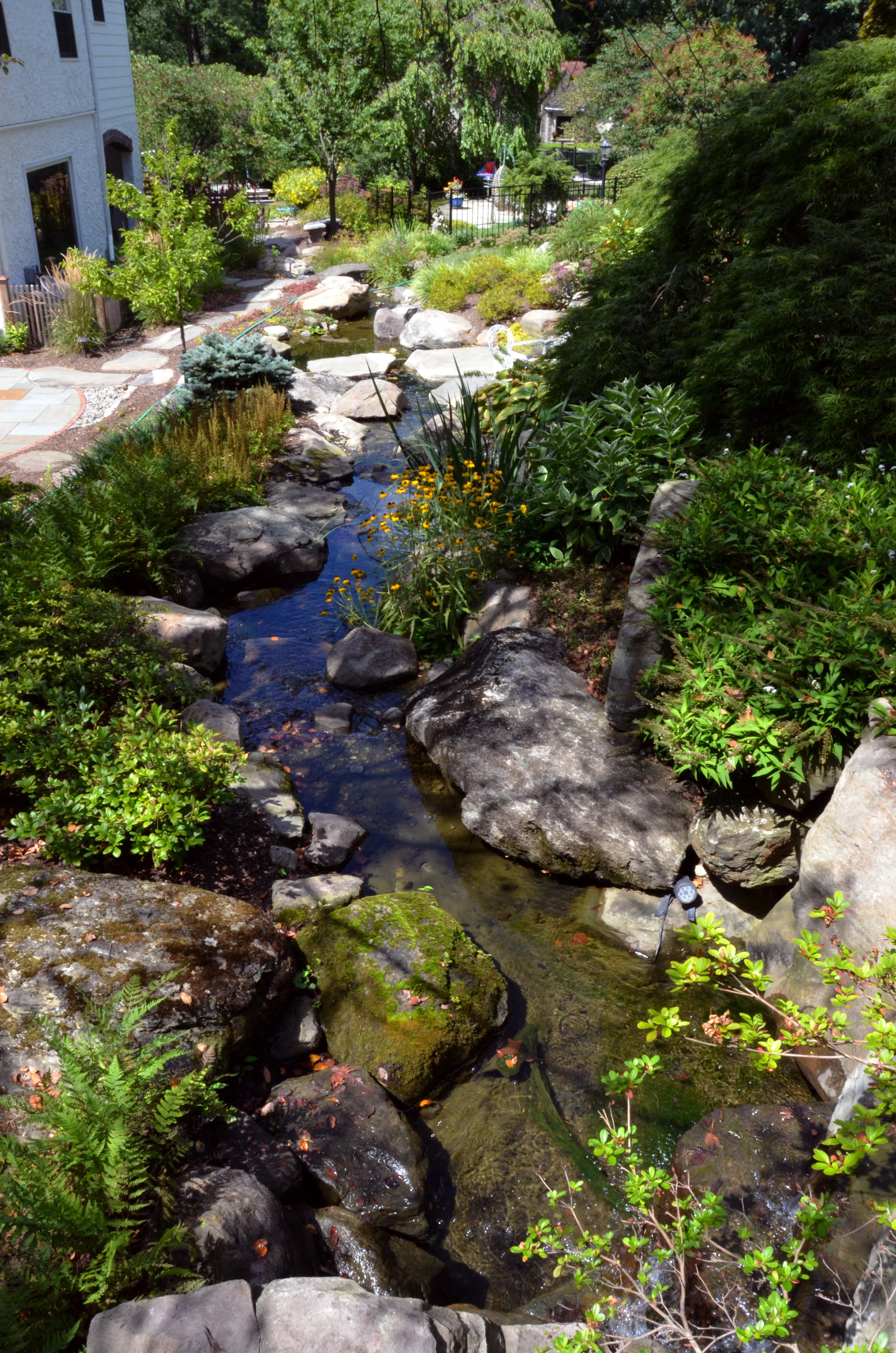 Pondworks_design build_custom_stream_rocks_boulders.jpg