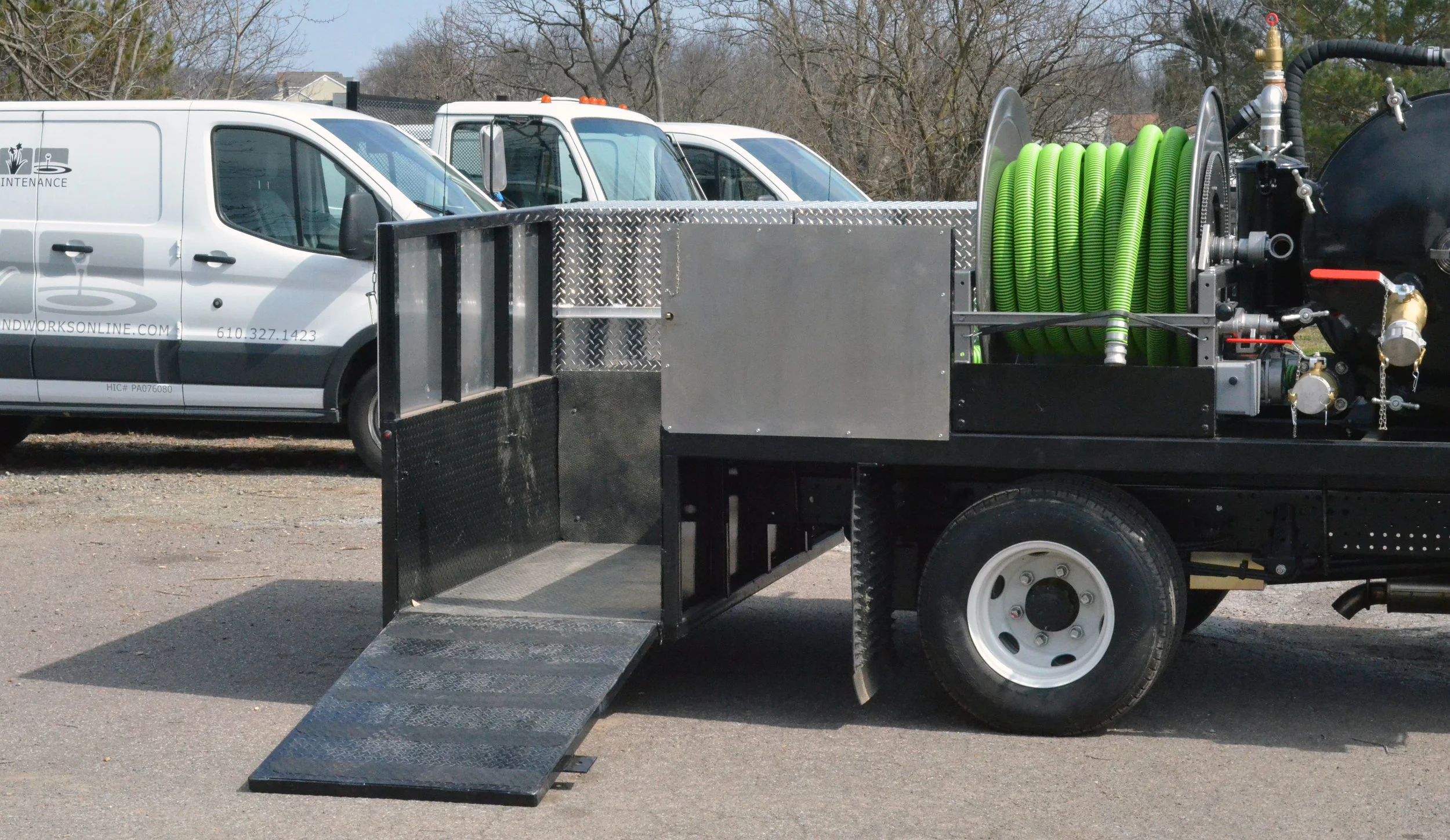Custom vacuum truck system including storage for all equipment necessary for pond maintenance