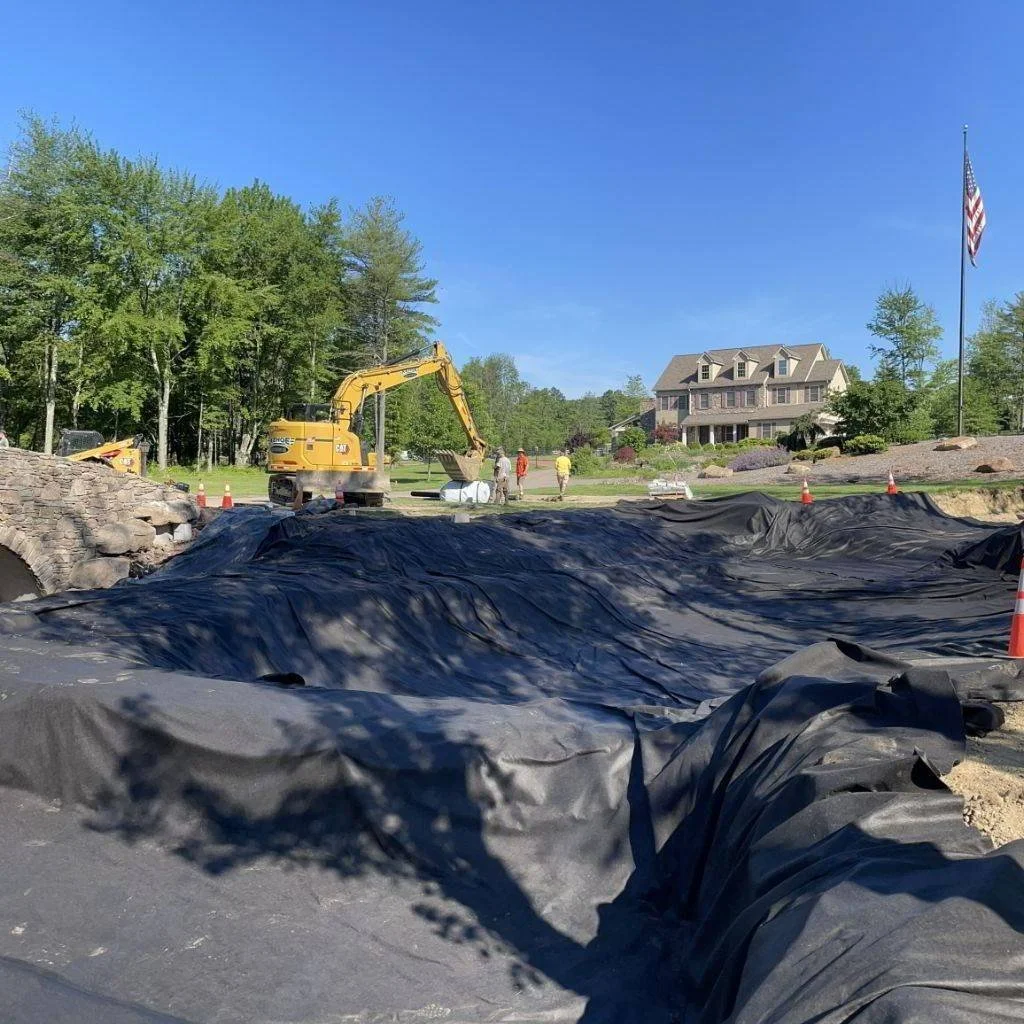 Rock work begins on waterfalls near the bridge.

#ponddesign #coolponds #largeponds #farmpond #designbuild #backyardconcepts #igers #montgomerycountypa #ProjectProgress #projectprogress #pond #pondworks_online #pondlife #pondview #PWLargePondandStrea