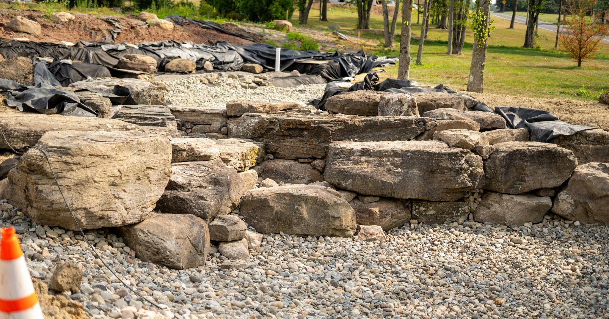 With the large waterfall completed, the bulk of the work on the upstream side of the driveway bridge is done! 

#ponddesign #coolponds #largeponds #farmpond #designbuild #backyardconcepts #montgomerycountypa #ProjectProgress #projectprogress #pond #p