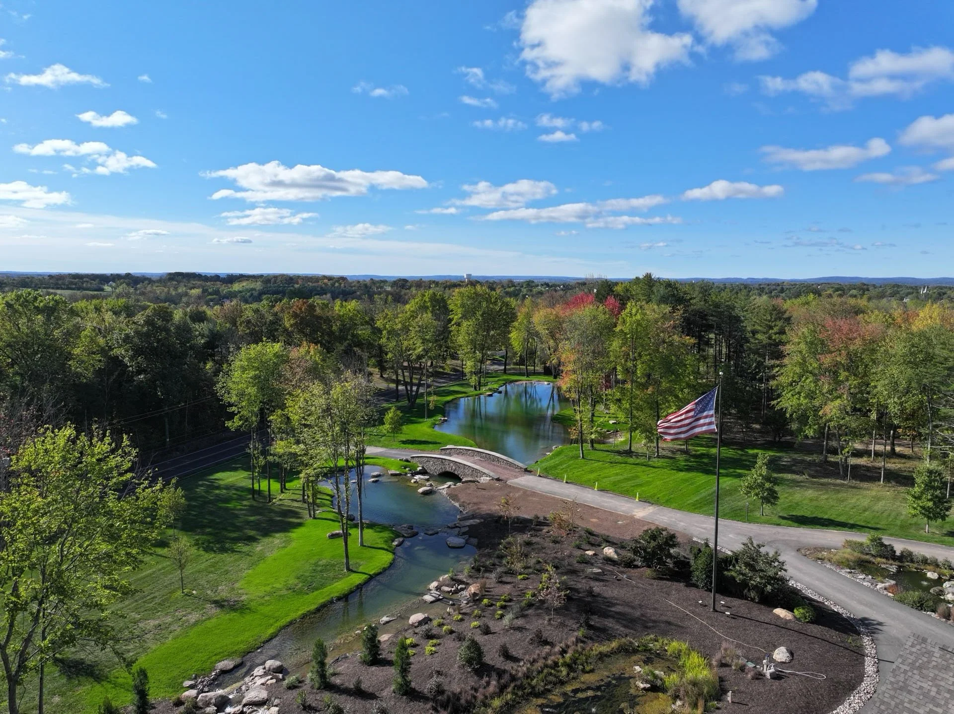 a-welcome-home-large-pond-aerial-view