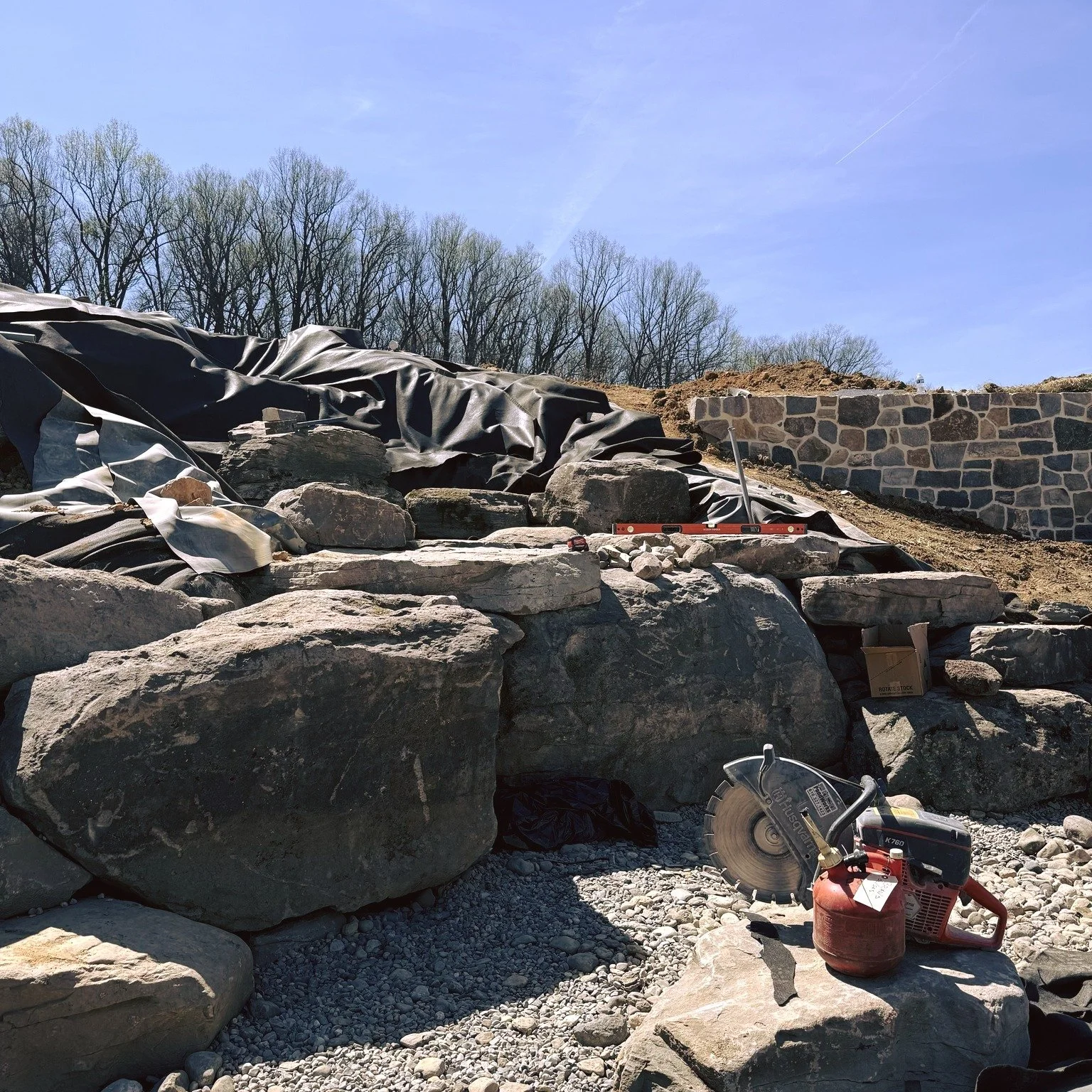 The boulders have arrived. 🪨
Rock work is officially underway on our Chester County, PA pondless waterfall build. These massive boulders are being carefully placed to create a natural, cascading flow &mdash; every stone chosen and positioned with in