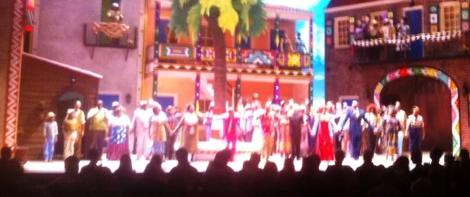 Curtain call at conclusion of May 30 performance of Spoleto's "Porgy and Bess;" In the bright red dress, created by Visual Designer Jonathan Green, is Alyson Cambridge, who played Bess. To her right is Lester Lynch, who is Porgy, and to her left, Eric Greene, who is Crown.