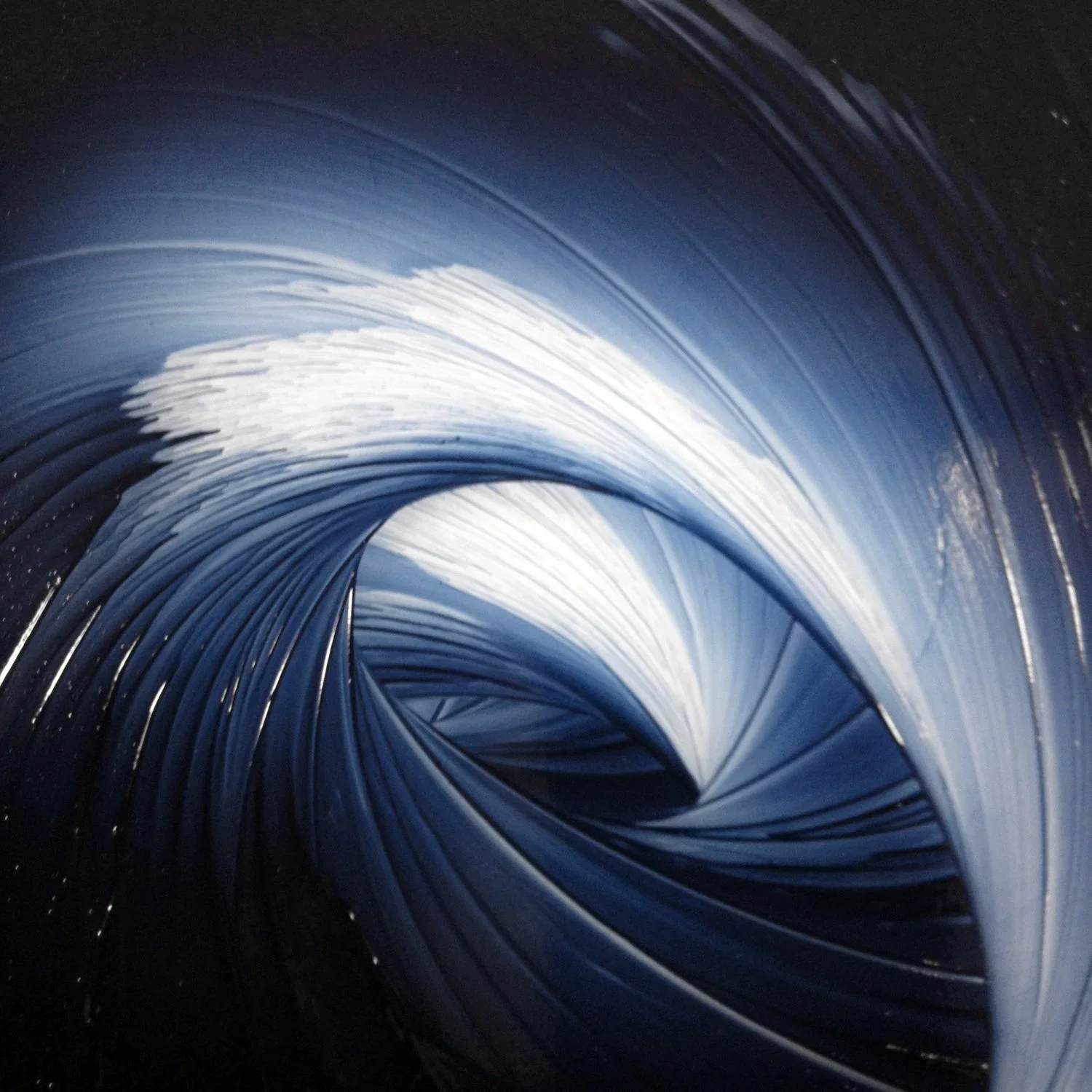 sweeps of indigo blue watercolor being prepared on a mulling slab