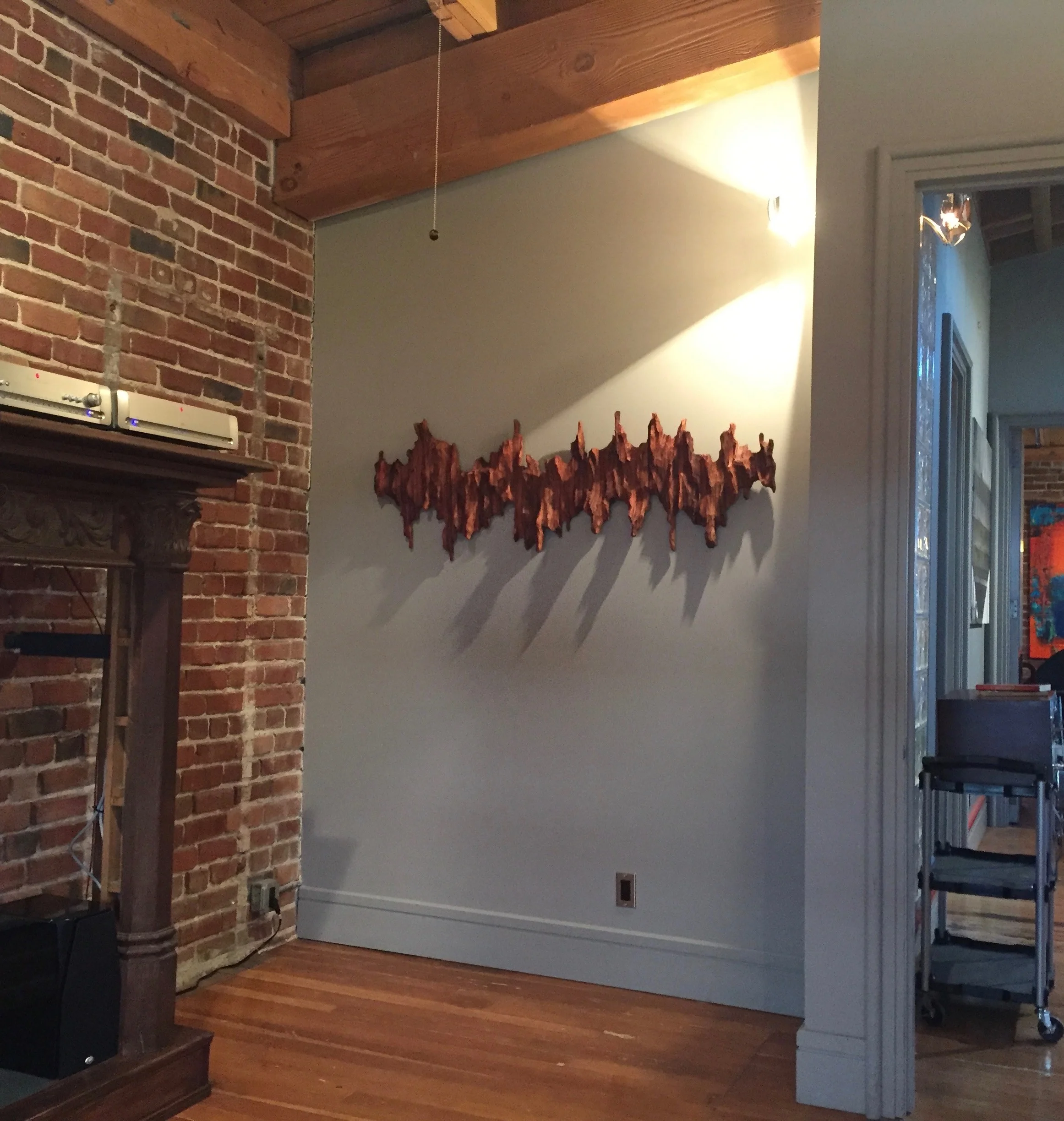 Wall sculpture “Soundwave II” at corporate event space in Oakland