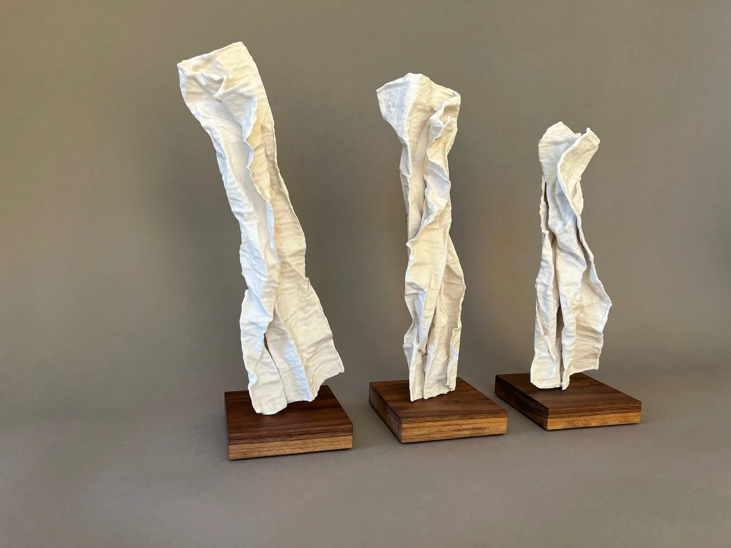 Leaning In 4 plaster sculptures by Lutz Hornischer.jpeg