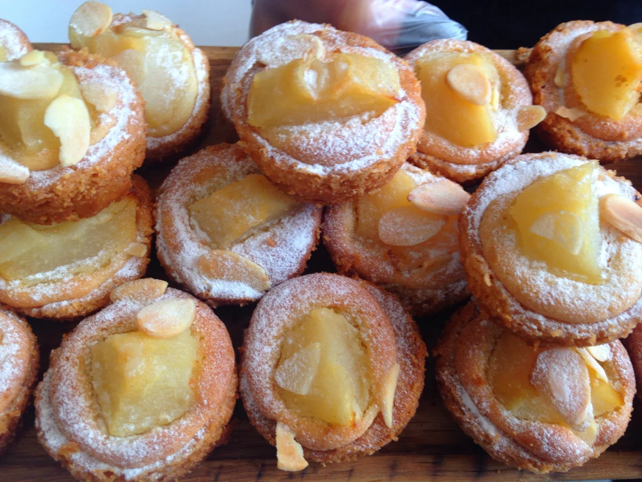 As many of your know, Cannelle Patisserie , the popular French bakery in East Elmhurst, is opening up a location in Long Island City under the new brick apartment building, the Maximilian. We passed by today, hoping they would be open, but alas they are not quite ready yet!
They were, however, offering up free samples of their delicious pear tarts, croissants, and coffee to passersby. According to staff, they will be opening their doors sometime next week!
View Queens, NY in a larger map