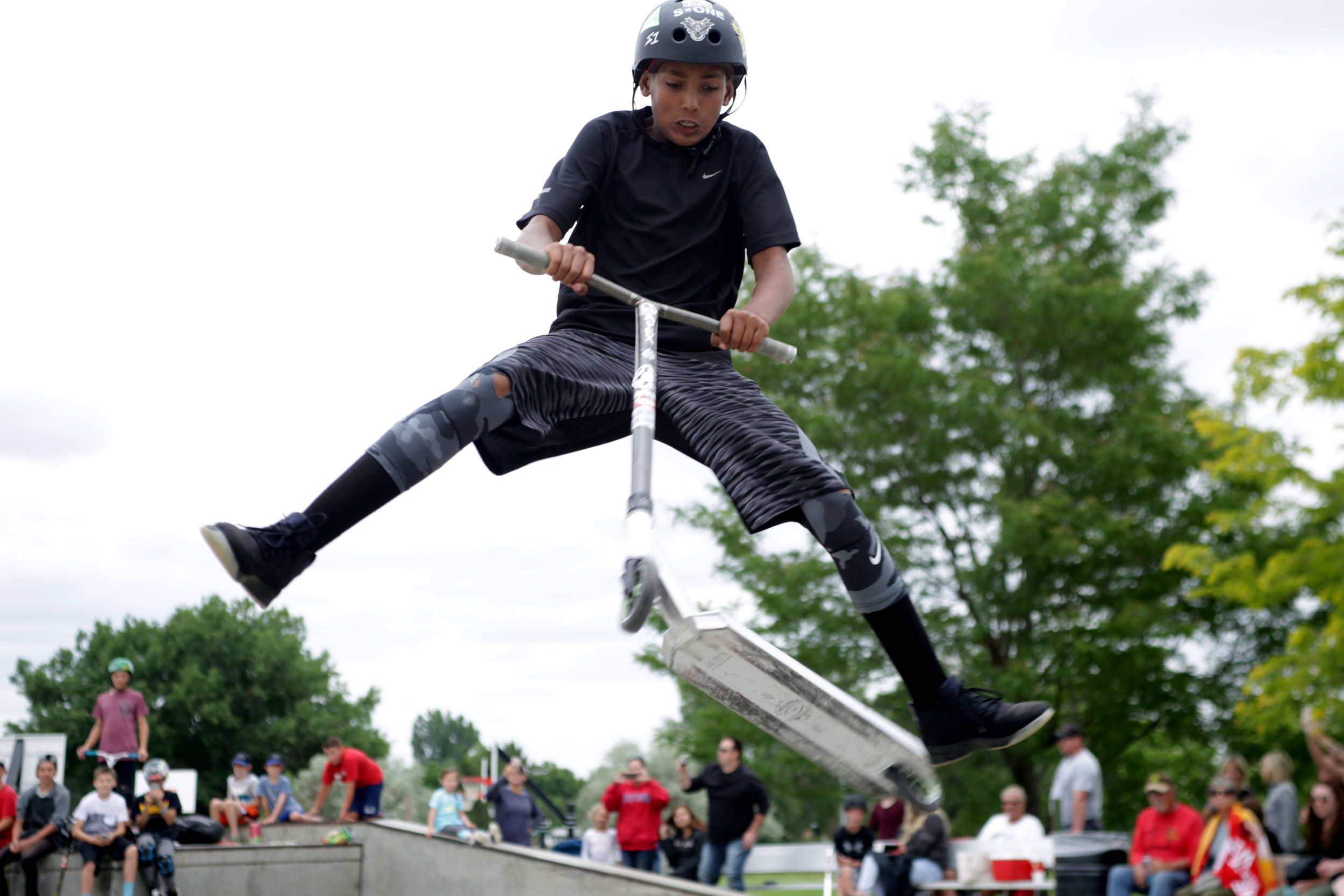 Terrick Wilkins 13, jumps over the ledge of a bowl at the Windsor, Colorado, Grind scooter and skateboarding competition, June 2017. The Windsor Grind was a joint effort put together by the Windsor Clearview Library District and Windsor Parks Recrea