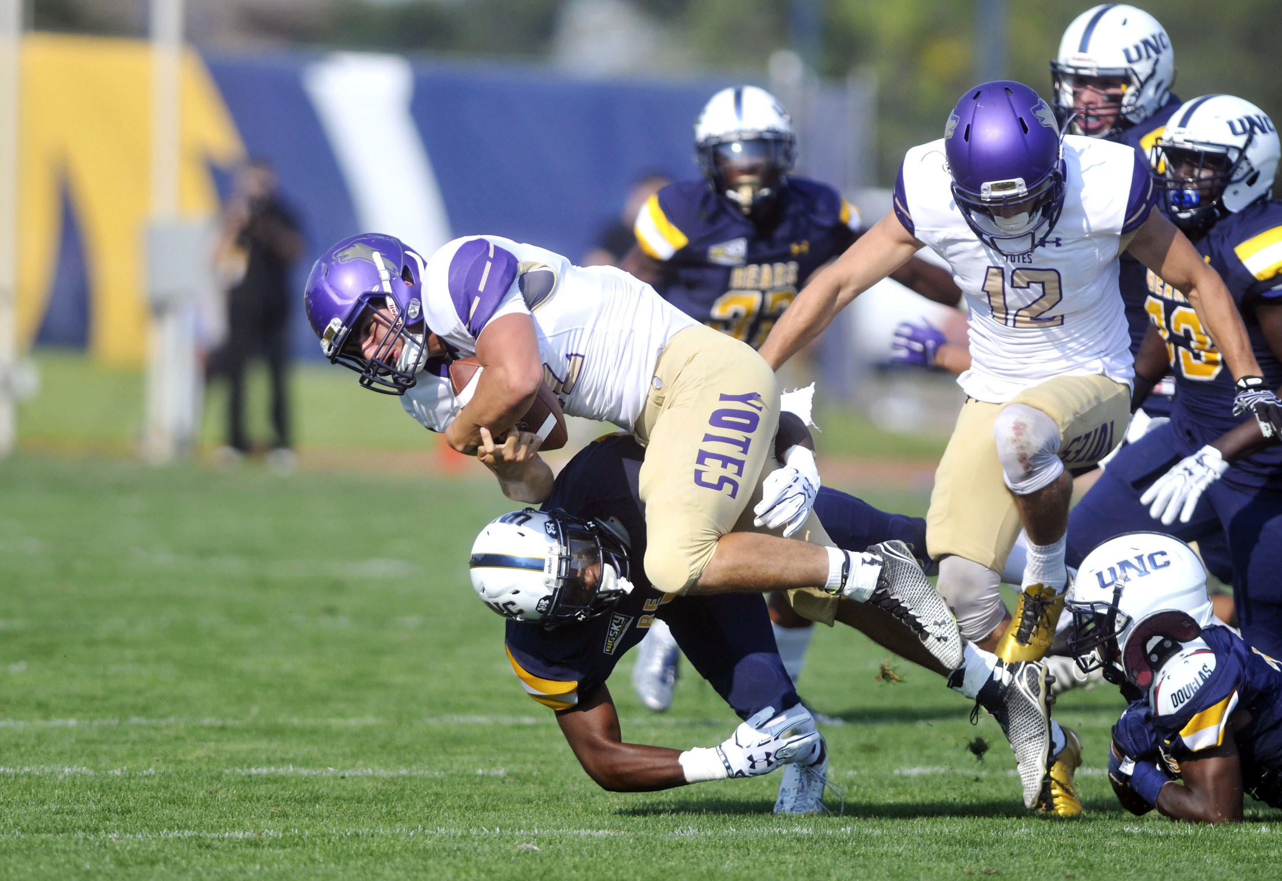  College of Idaho's&nbsp; Nick Calzaretta gets tackled by University of Northern Colorado's Michael Walker on during a football game at Nottingham Field in Greeley, September 2017. 