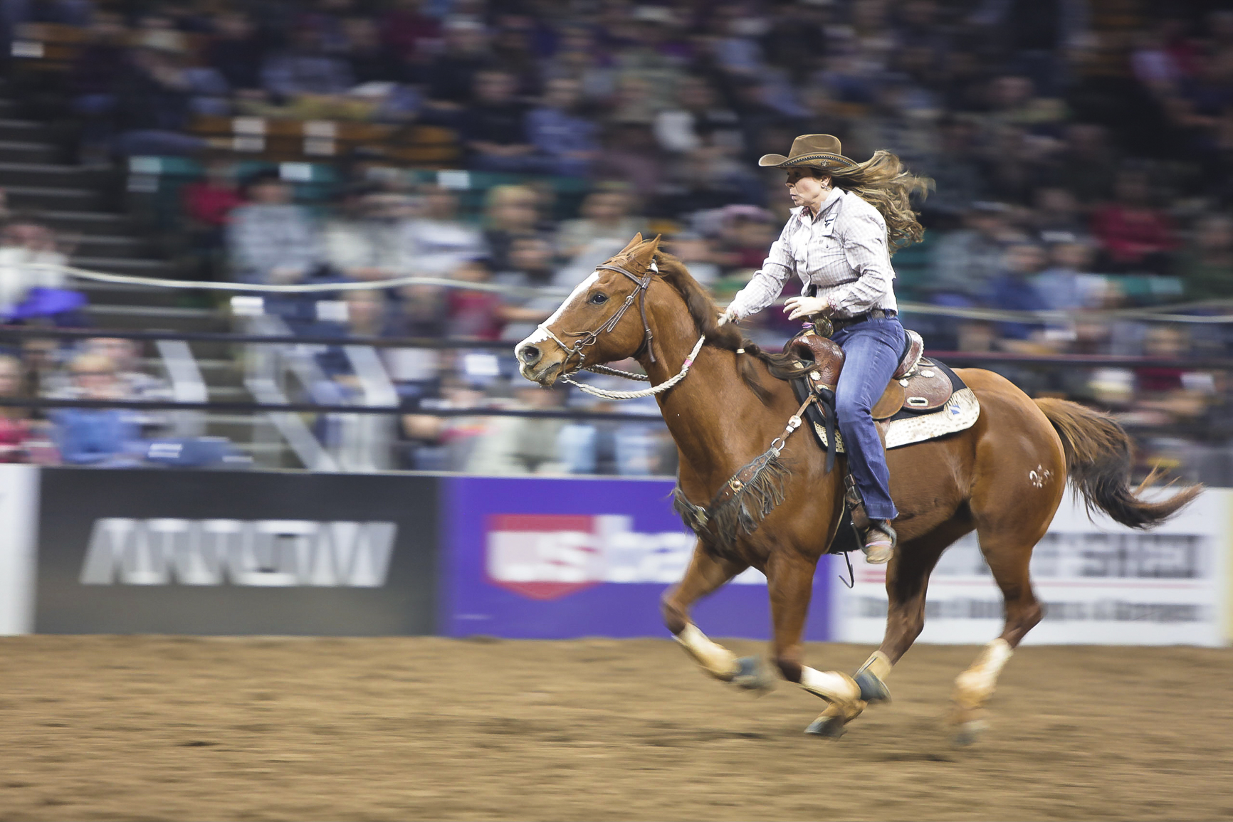  A cowgirl rides her horse during a barrel race at the National Western Stock show in Denver, Colorado, in January 2018. 