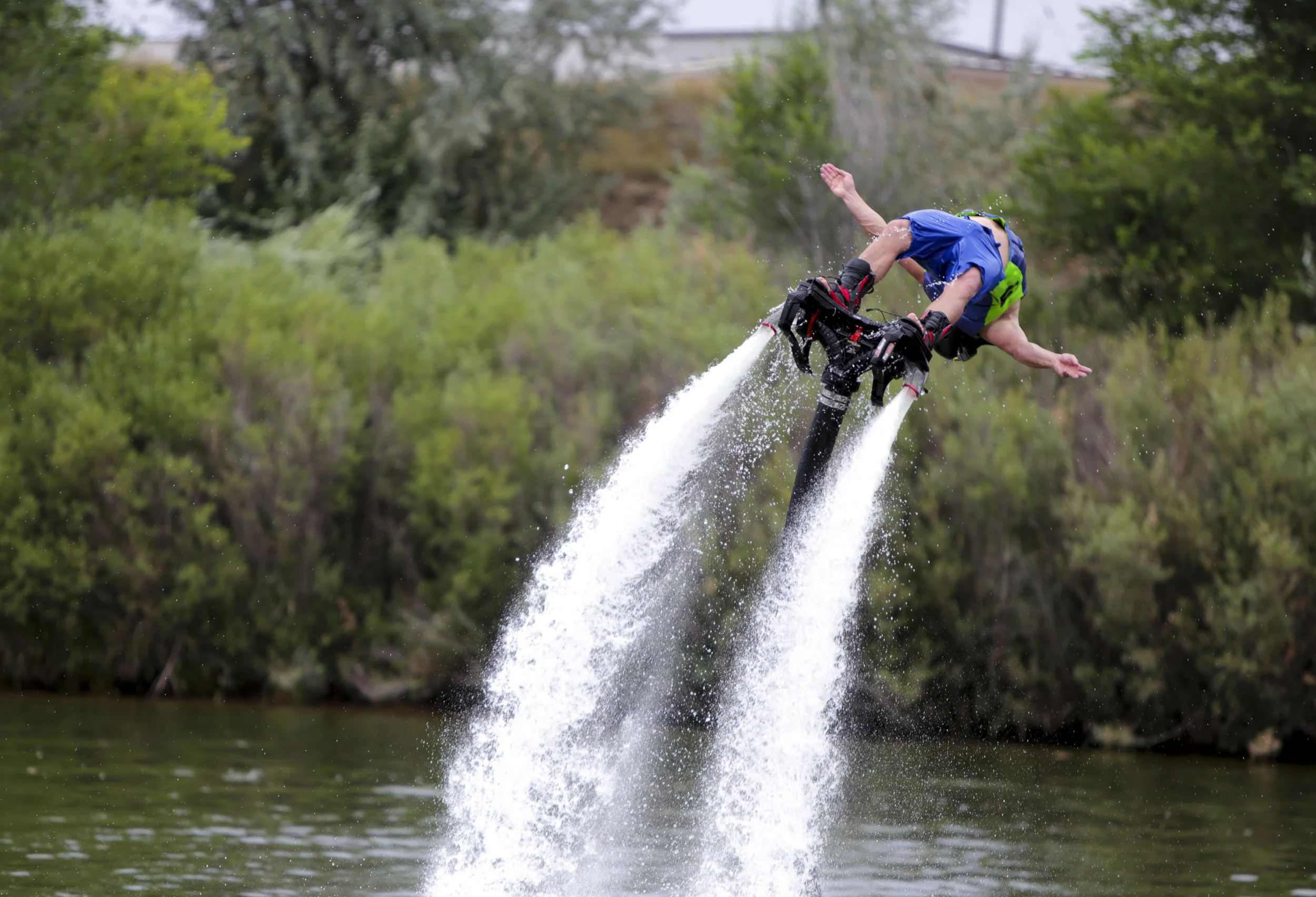 Chris Hock does a backflip on a fly board during the Bridge the Gap wakeboard and waterski tournament on Saturday at Madison Lake in Greeley, Colorado. The purpose of the event was to honor Scott Barone a wakeboarder who passed away. Additionally the event was sponsored by Tommy's Colorado, a water sports retailer and the event hosted many types of water sports.