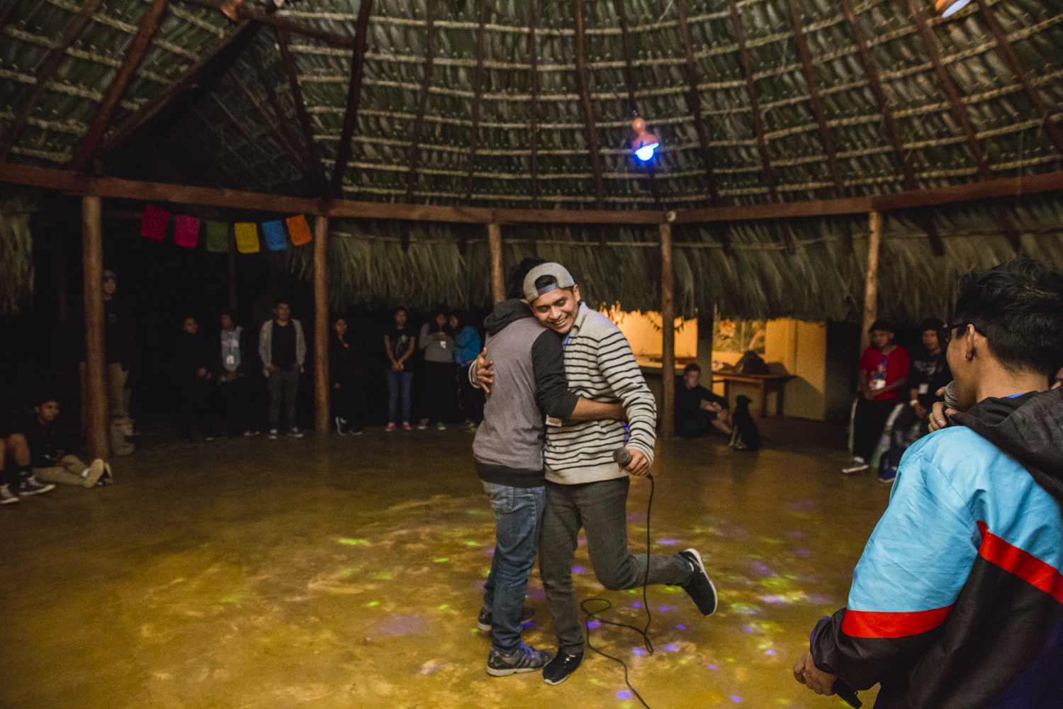 Edwin Gomez “DeThe” left, and Ermar Sumoza “13” right, hug after battling each other in a freestyle in San Marcos La Laguna, Lake Atitlán, on December 15, 2018.