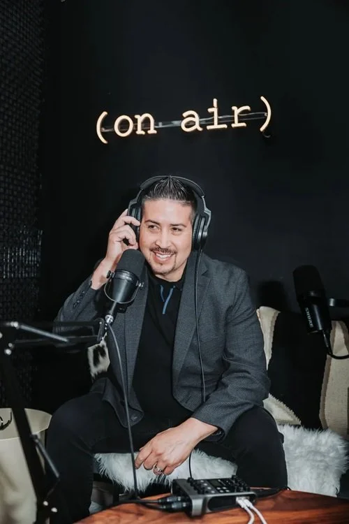 podcast host recording in studio, example of intentional business content strategy and visual branding