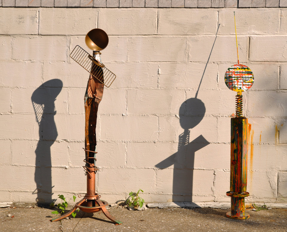 SOME OF THE ART IN DANIEL SWANIGAN SNOW'S BACKYARD.