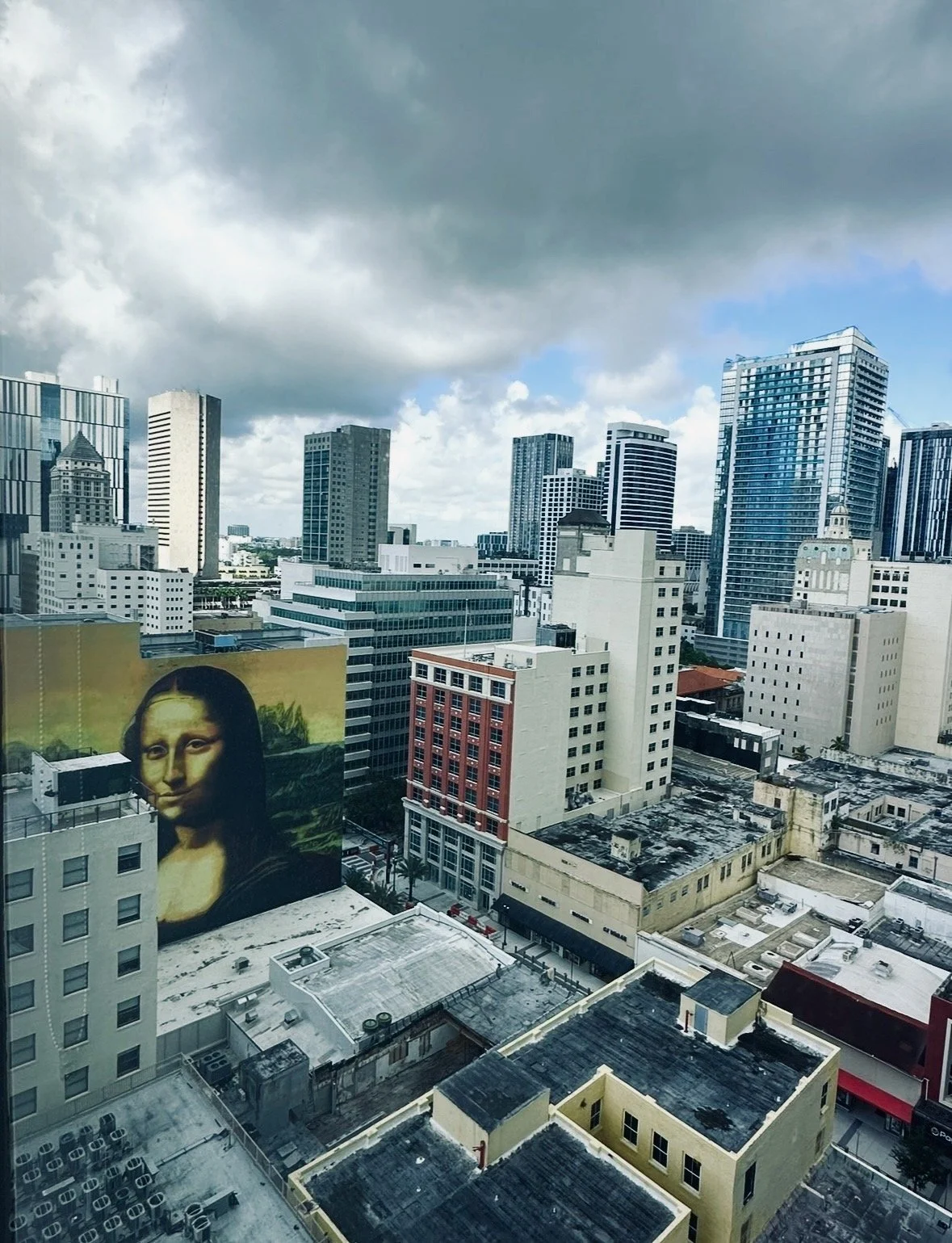 Downtown Miami skyline with Mona Lisa mural and surrounding buildings