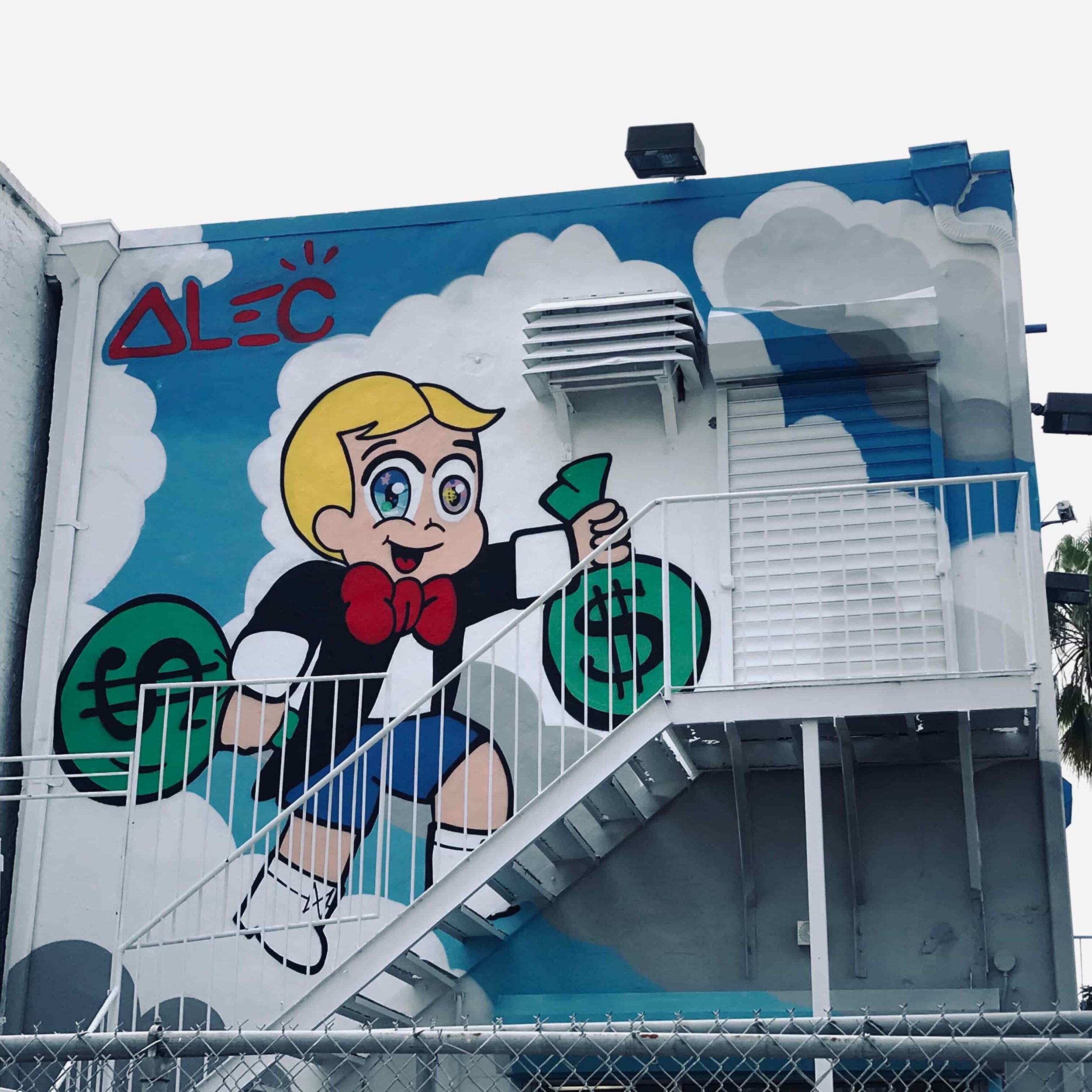 Richie Rich is going UP stairs holding
