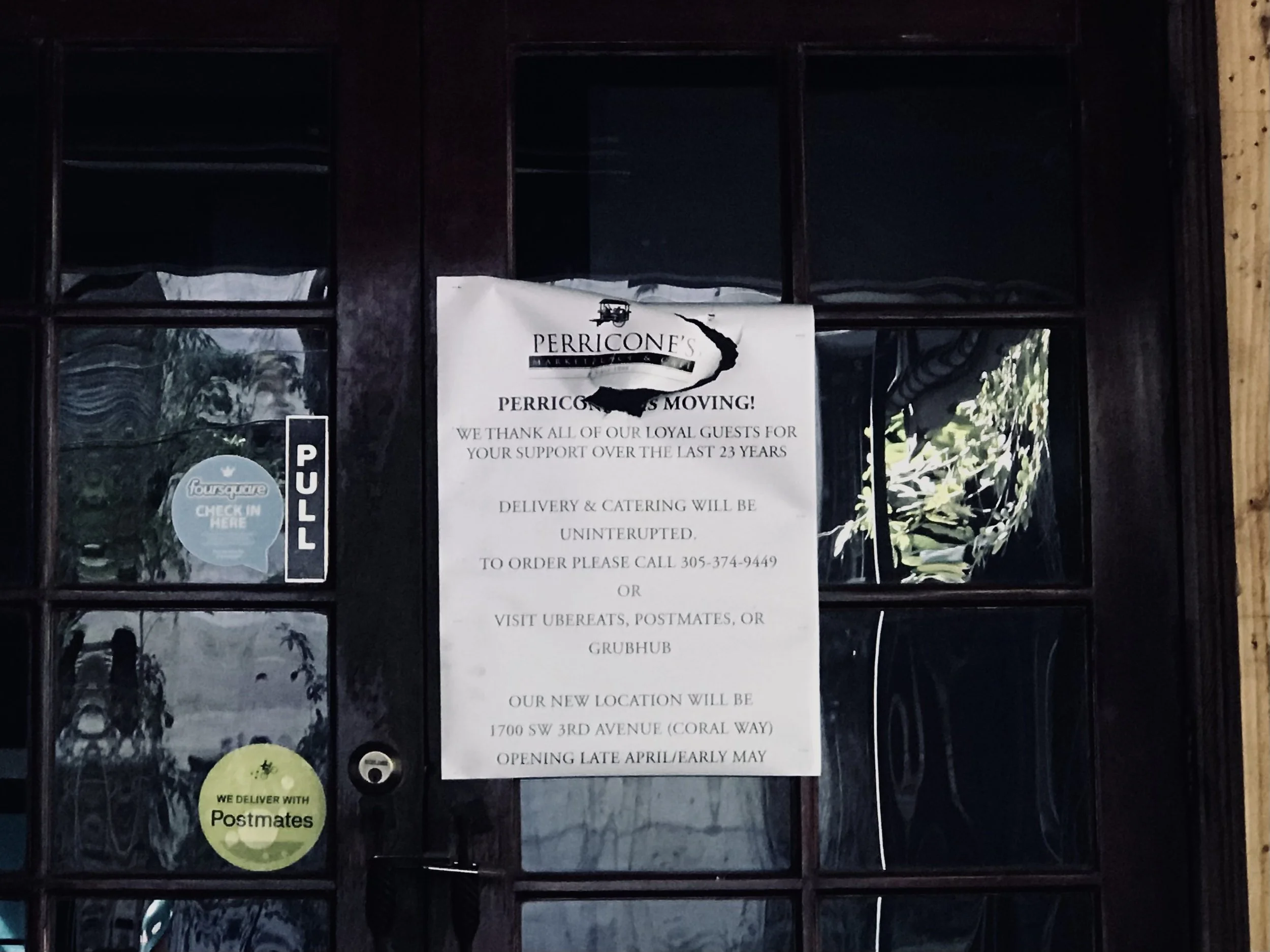 Printed notice on the entrance of Perricone's Marketplace in Brickell thanking customers for 23 years of support before the restaurant's demolition in 2019.
