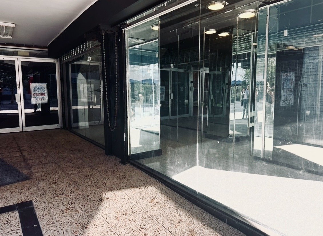 Empty glass retail storefront in downtown Miami